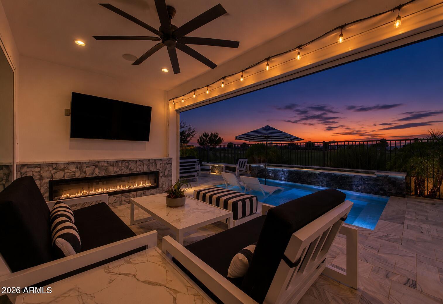 Some homes have upgrades. This one has a destination. Perfectly positioned along the 11th green on one of Sterling Grove's most coveted golf course homesites that cannot be duplicated and is rare at best. This exceptional residence captures breathtaking fairway and White Tank Mountain views. Inside, refined finishes include wood-look tile, plantation shutters, a truly chef ready kitchen with dramatic waterfall island, and expansive multi-slide glass doors that blur the line between indoors and out. The resort-inspired backyard features a sparkling pool with Baja shelf, outdoor fireplace, built-in BBQ, and spectacular entertaining spaces overlooking the course. A rare opportunity to own one of Sterling Grove's most exceptional homes and experience Arizona resort living at its finest. The owner's suite includes an ensuite bathroom with dual vanities, a glass-enclosed shower, and a walk-in closet. The main level also offers a sizable den perfect for an office, and a convenient powder room. The spacious loft works as a family area or entertainment center. Upstairs, discover a 2nd main bedroom with its own bathroom & walk-in closet. The entertainer's backyard is an oasis, featuring a covered patio with a wet bar, recessed fireplace, and a motorized shed for added privacy and relaxation. Enjoy a built-in grill and pizza oven, cocktail pool, fire pit, fully tiled patio, and breathtaking views stretching up the 12th fairway to the stunning White Tank Mountains. This home is a true gem, an absolute must-see!