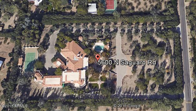 Multiple offers at Highest & Best can submit until 5/21/15 noon.. Paradise Valley's most exclusive address, nearly 5 gated acre estate.  Floor plan flows graciously, perfect for entertaining on a grand scale or casual family living.  Built as a compound, with a 2 bedroom guest home (living room + kitchen)over the 4 car garage and a second guest home in the motor court. Commercial elevator, gourmet kitchen + summer kitchen, massive master with 2 marble baths and 2 large walk in closets. 13 fireplaces, stunning grounds with pool, fountains and a tennis court.  One of a kind estate for priced closer to the value of the land. Seller will request a title company and Seller's addendum follows an accepted offer. Attach Proof of Cash or Pre-qual. See private remarks before showing..