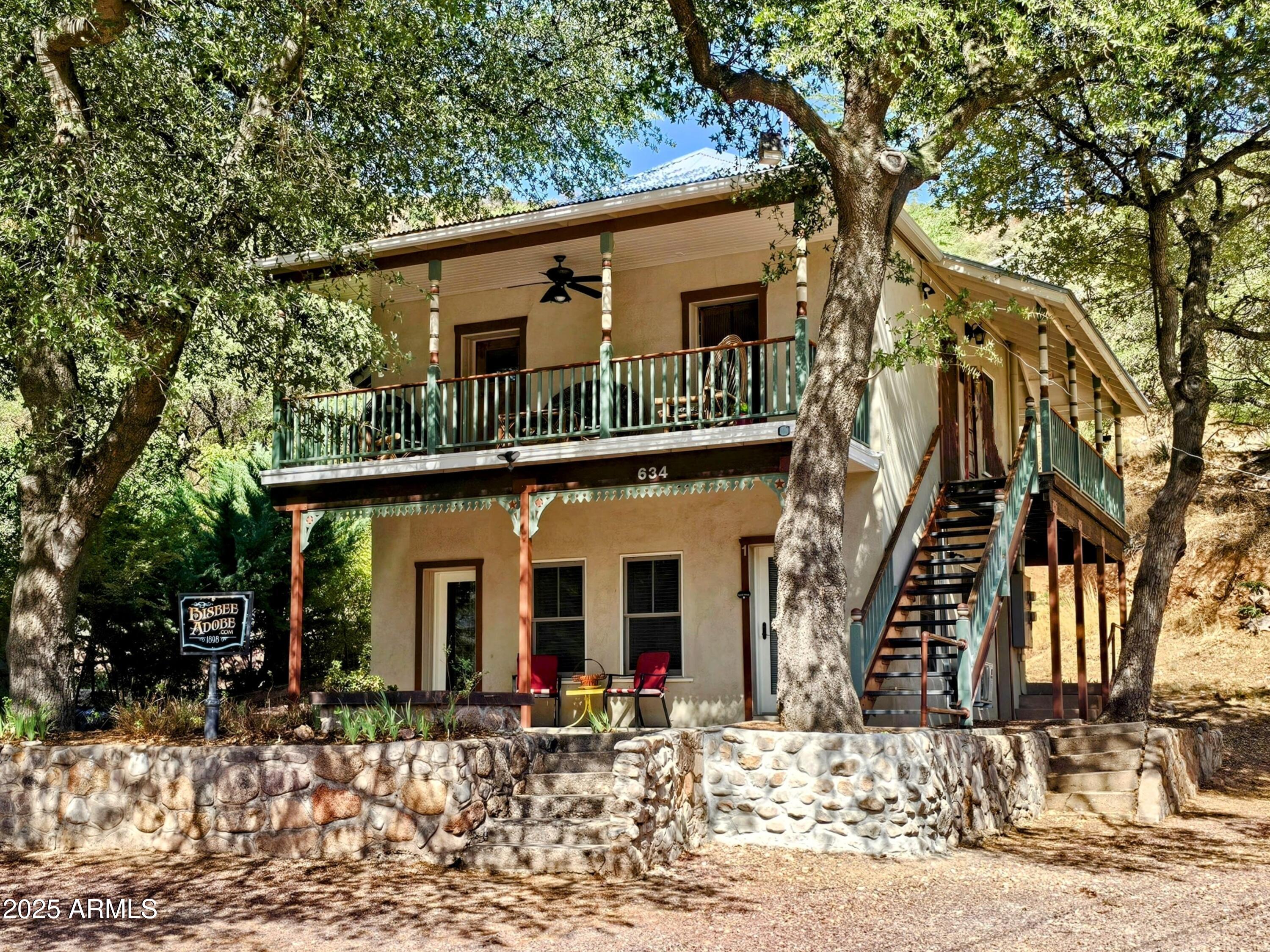 Truly Historic Old Bisbee Adobe, Completely Restored, Two Stories, Two Separate 678 sq ft Apartments and Deeded Off-Street Parking. Believed to date back to 1898, originally built as a miners rooming house, now updated with 200 Amp Panel, Central Heat and AC, Mini-Splits, Metal Roof, all newer fixtures, appliances, plumbing, flooring and more. Set back from the road, and surrounded by mature trees.
Both Apartments are Two Bedroom/One Bath, with their own In-Unit Washer/Dryer, Full Kitchens, separate entrances, electric meters and Covered Porch/Balcony.