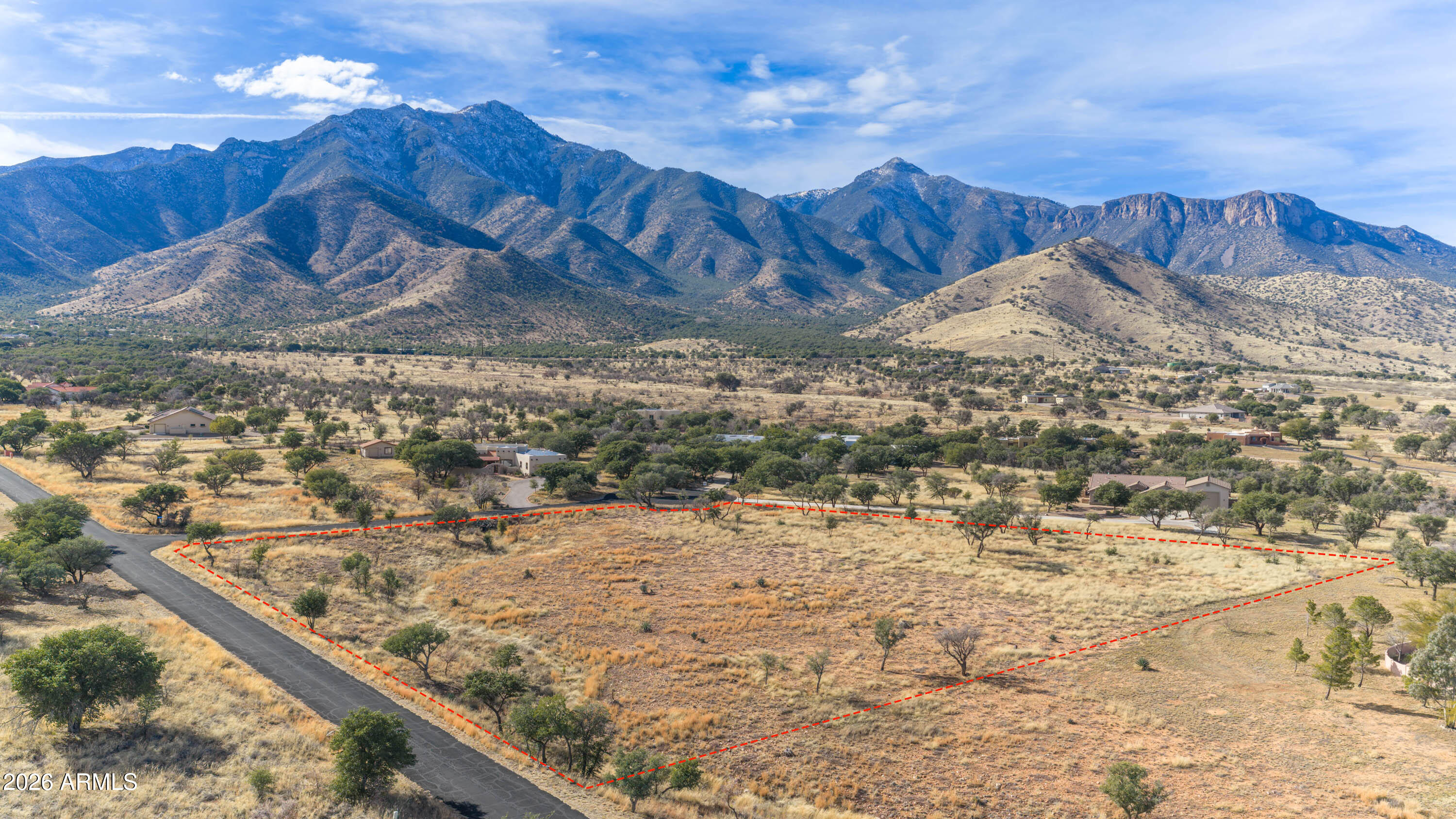 Build your next dream home on this 3.5+ acre cul-de-sac lot in the prestigious Wild Horse community. Enjoy wide-open space, mature trees, and sweeping mountain and valley views in a peaceful, gated setting. Tucked away yet conveniently located just a short drive from Sierra Vista, this property offers privacy, scenery, and room to create the home you've been envisioning.