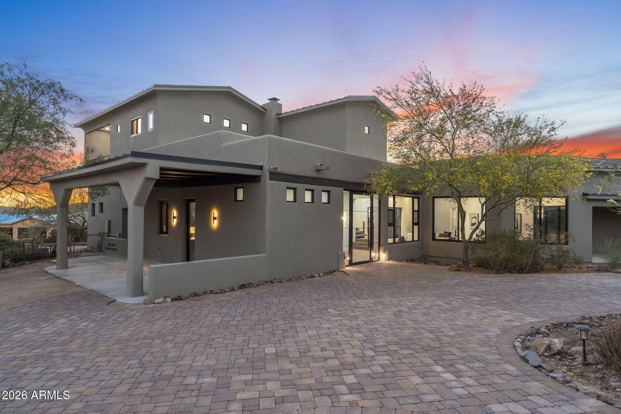 Crafted by a contractor for himself -- and it shows. This 5-acre elevated compound on fully paved Sierra Vista Road delivers over 6,000 square feet of garage space: an air conditioned 4,000+ SF work/flex garage, a dedicated single-car show garage, a 4-car garage in the main house, and an oversized 3-car garage in the guest house. BIG views and horse privileges. This completely remodeled compound is move-in ready. Featuring all the Cave Creek privacy with none of the gravel road compromise. If you need serious space -- for work, equipment, a collection, or a business operation -- this property was purpose-built for exactly that.  The 4,000+ SF work garage was built by someone who actually uses one -- with the ceiling clearance, floor load, and air conditioning that serious operators demand The single-car show garage is separate and purpose-built, because the builder understood the difference between a car that gets driven and one that gets displayed.
 
The main house offers a 4-car attached garage. The guest house -- a fully independent structure -- adds an oversized 3-car garage. Total enclosed capacity approaches 13+ cars, not counting the work building.
 
The elevated 5 acres delivers long-range desert views with natural separation from neighbors that flat lots can't replicate at any price. Fully paved road access means no dust intrusion, no monsoon season headaches, and no excess wear on the vehicles you've worked hard to collect.
 
The main house and guest house are fully remodeled and move-in ready -- nothing to phase in, nothing to negotiate around. Horse privileges are in place for a buyer who wants that optionality without a rezoning conversation.
 
This home and Cave Creek are perfect for those who aren't interested in being noticed, but want their friends and family to be comfortable once your there. No HOA. No neighbors 12 feet away. Just acreage, privacy, and the freedom to run a property the way you want. This compound delivers all of it -- and properties built to this standard rarely come available.