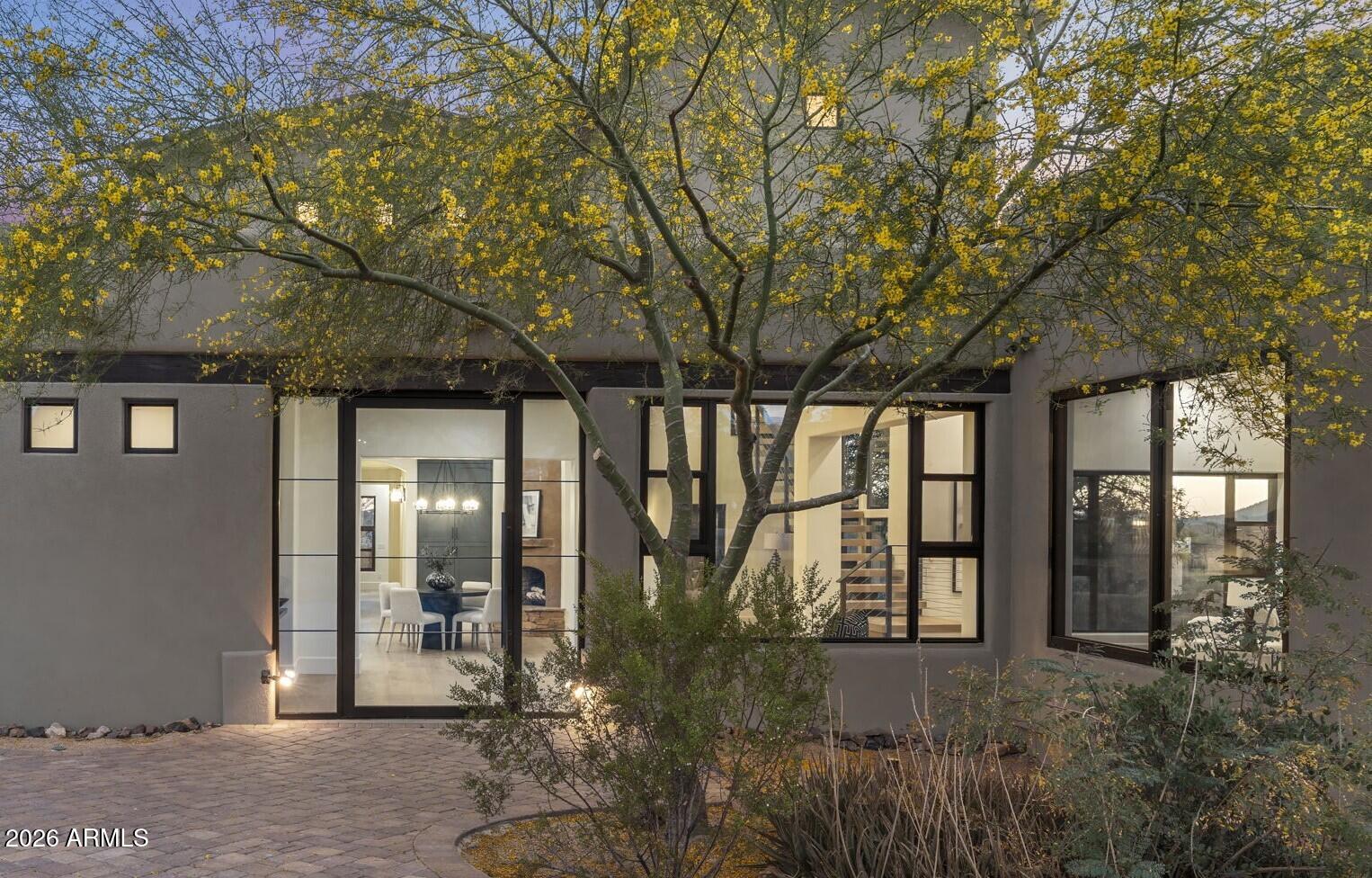 Crafted by a contractor for himself -- and it shows. This 5-acre elevated compound on fully paved Sierra Vista Road delivers over 6,000 square feet of garage space: an air conditioned 4,000+ SF work/flex garage, a dedicated single-car show garage, a 4-car garage in the main house, and an oversized 3-car garage in the guest house. BIG views and horse privileges. This completely remodeled compound is move-in ready. Featuring all the Cave Creek privacy with none of the gravel road compromise. If you need serious space -- for work, equipment, a collection, or a business operation -- this property was purpose-built for exactly that.  The 4,000+ SF work garage was built by someone who actually uses one -- with the ceiling clearance, floor load, and air conditioning that serious operators demand The single-car show garage is separate and purpose-built, because the builder understood the difference between a car that gets driven and one that gets displayed.
 
The main house offers a 4-car attached garage. The guest house -- a fully independent structure -- adds an oversized 3-car garage. Total enclosed capacity approaches 13+ cars, not counting the work building.
 
The elevated 5 acres delivers long-range desert views with natural separation from neighbors that flat lots can't replicate at any price. Fully paved road access means no dust intrusion, no monsoon season headaches, and no excess wear on the vehicles you've worked hard to collect.
 
The main house and guest house are fully remodeled and move-in ready -- nothing to phase in, nothing to negotiate around. Horse privileges are in place for a buyer who wants that optionality without a rezoning conversation.
 
This home and Cave Creek are perfect for those who aren't interested in being noticed, but want their friends and family to be comfortable once your there. No HOA. No neighbors 12 feet away. Just acreage, privacy, and the freedom to run a property the way you want. This compound delivers all of it -- and properties built to this standard rarely come available.