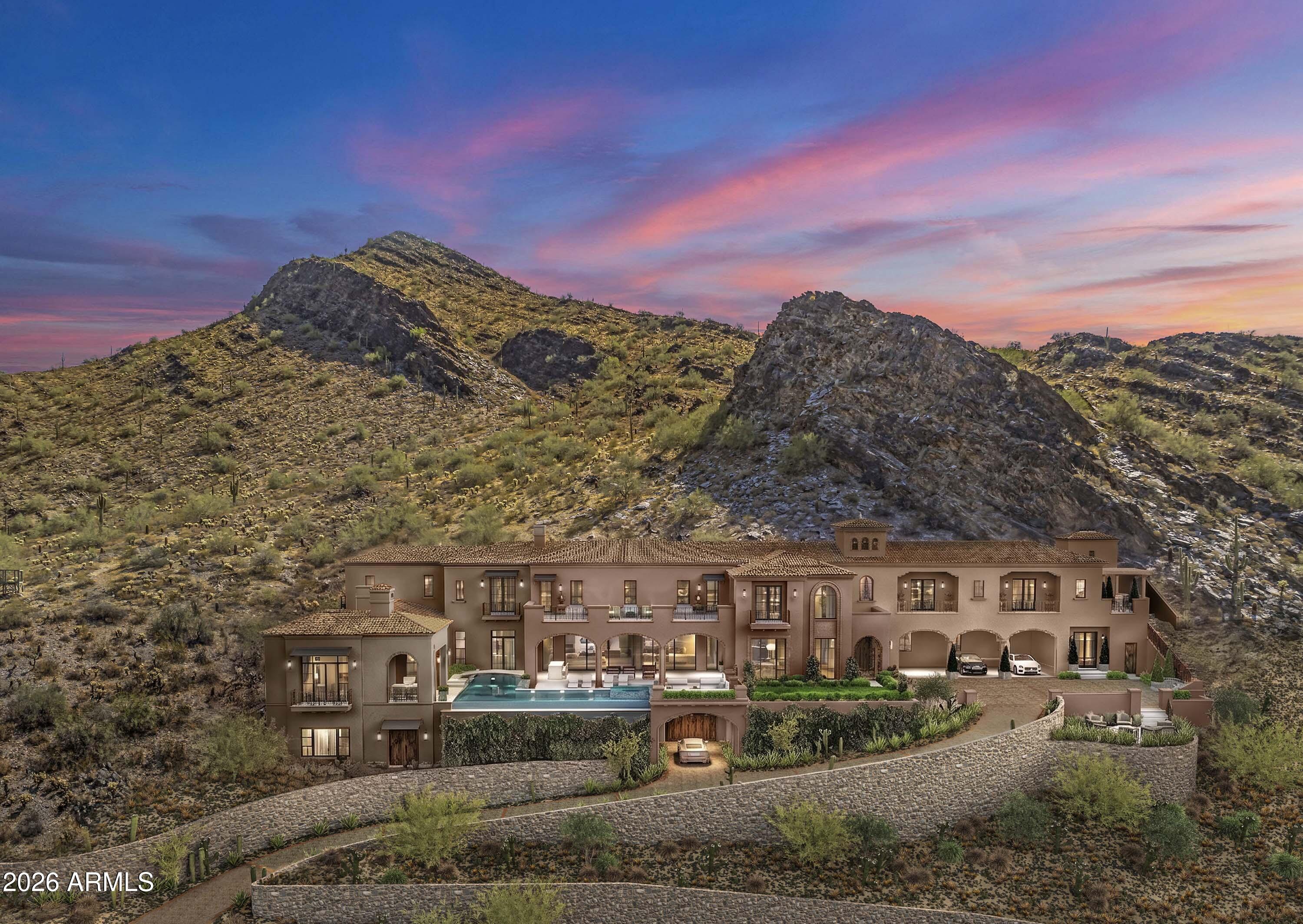 Vistaero--Located within Silverleaf, this estate is a singular expression of grandeur rising from a five-acre hillside within North Scottsdale's most coveted guard-gated enclave. Created by the celebrated triumvirate of architect Scott Carson, builder Nicholas Development Group, and interior designer Kristin Hazen, this estate captures sweeping mountain panoramas and glowing Arizona sunsets from every vantage point. The main and upper levels offer a primary suite, entertainment lounge, gym, upper balcony, and a fire pit, plus a guest wing offering four split en-suite bedrooms, along with a private entrance,  While the lower level offers a speakeasy and a garage accommodating up to 16 vehicles--or an indoor pickleball court--reflect a residence conceived for both distinguished entertaining and effortless private living. A resort-style pool with a baja shelf and hot tub anchors the outdoor sanctuary, where the luminous beauty of the Sonoran Desert unfolds in every direction. Newly completed and ready for immediate preview, this property represents a rare convergence of artistry, privacy, and elevated desert living at its most refined.