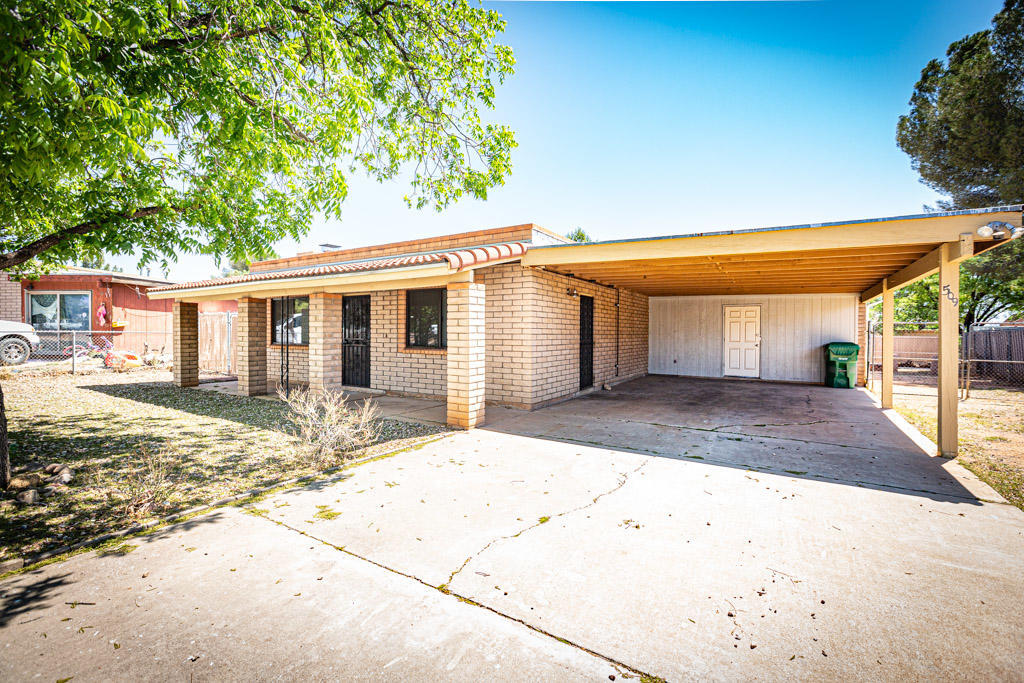 Charming 3 bedroom 2 bath brick home in a perfect location. Great security with fully fenced property with gated driveway. Spacious attached workshop off of the carport. Enjoy the amazing Arizona life outdoors under your covered front porch. Added storage shed located in backyard. New air conditioner installed in 2020. Call today for your private showing.