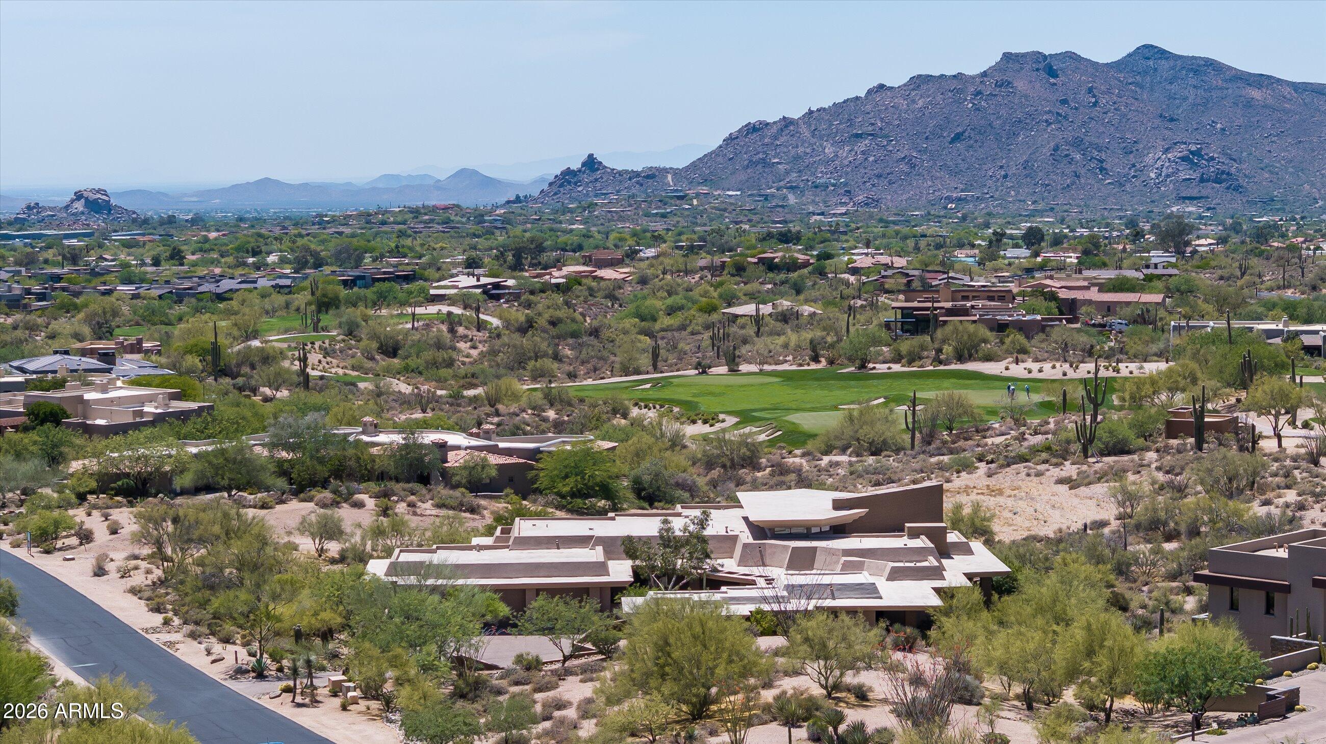 Golf membership is available to the Desert Mountain Club. This is a 5-bedroom, 4.5-bath home, including a 2-room detached guest house, with a pool and a 3-car garage. This single-level, zero-step home offers open-concept living, light, and bright soft contemporary style. Enjoy mountain and sunset views, along with a glimpse between the 14th and 15th holes of the Renegade Golf Course. Located in Gambel Quail, Desert Mountain's first village, it offers easy access in and out. Priced at $650 per square foot, this is a rare opportunity to buy a custom home in a gated community and add your own finishing touches!
