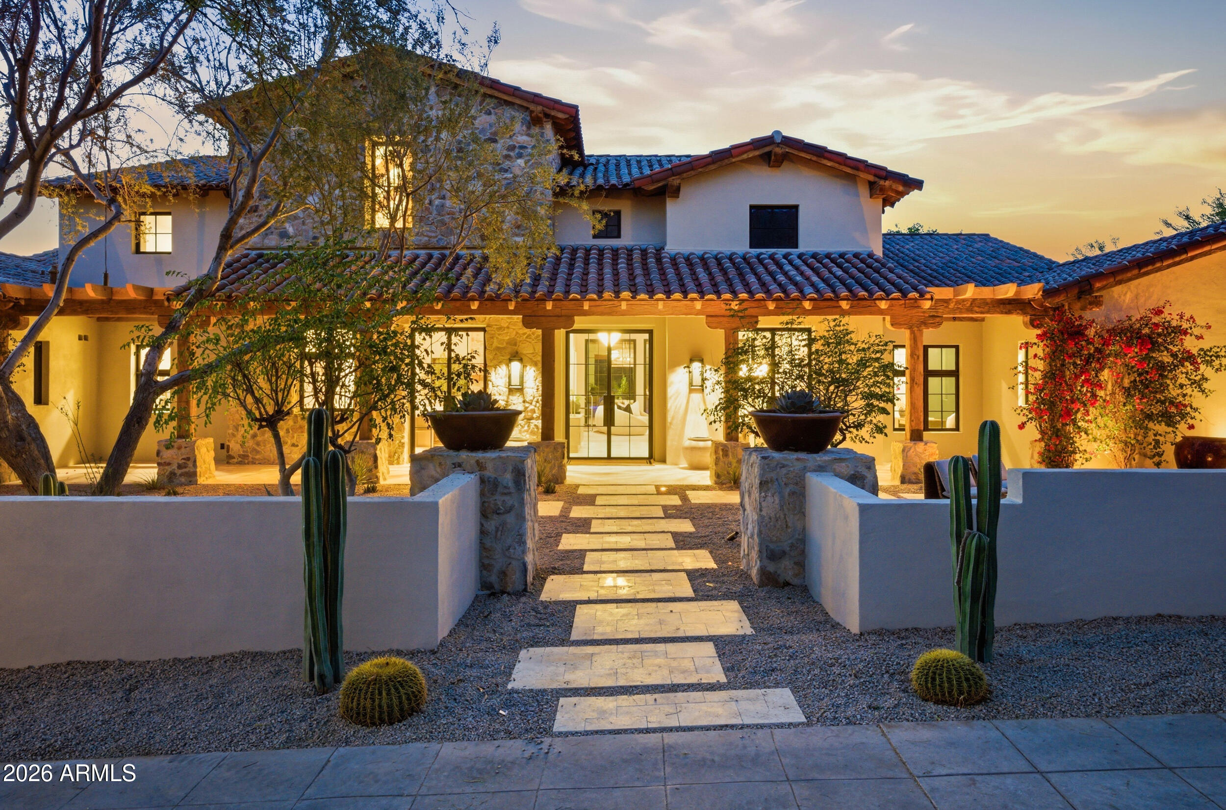 Montecito-inspired masterpiece meets Silverleaf sophistication. This 6,000+ sq ft single-story rambler on 3/4 acre blending warm California ranch vibes w/ modern desert luxury. Sitting behind the gates of Silverleaf off Windgate Pass delivering effortless resort-style living throughout. Thoughtful, flowing layout designed for both everyday living & elevated entertaining w/ seamless indoor-outdoor flow. Fully reimagined w/ new roof, new HVAC systems, new water heaters, all new 9.5'' wood plank flooring, handmade tiles, custom wallpaper, doors including 12 handcrafted iron French custom doors that set a striking first impression. Chef's kitchen impresses w/ modern features & conveniences including Wolf & Sub-Zero appliances, including full-size refrigerator & freezer, ice maker, dual dishwashers, additional Sub-Zero garage refrigerator & freezer, + beverage fridge in the bodega. Primary retreat w/ indoor/outdoor shower option, free standing concrete soaking tub, radiant heated floors, + expansive walk-in closet w/ enhanced lighting, built-ins & washer & dryer hookups. 4 additional en-suite bedrooms, including casita w/ private entrance & built-in beverage fridge. Multiple outdoor dining & entertaining spaces w/ views of the mtns, new Pebble Tech pool & tile, 2 fireplaces + a fireplace. Customized utility room w/ dual washers & dryers + plenty of built-in storage w/ under lighting. Conveniently crafted smart home including surround sound throughout. Media room, office + bunk room complete this turnkey estate. Walking distance to Stonehouse & lake within gates. Timeless. Polished. Refined. Luxurious w/ no details spared. Don't miss the opportunity to own in the exclusive Silverleaf gates!