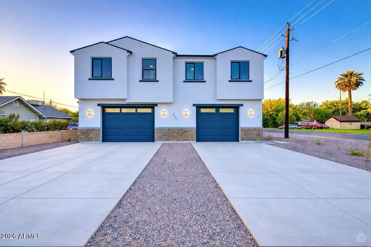 Discover modern living in this stunning newly built two-story duplex located in the desirable Camelback East neighborhood. This exceptional duplex home features  three spacious bedrooms with expansive walk-in closets and two and a half elegant bathrooms showcasing high-end finishes on each unit. The open-concept layout seamlessly connects the gourmet kitchen to the living areas, perfect for entertaining guests or family gatherings. Step outside to a large backyard ready for your personal design, offering endless possibilities for landscaping and outdoor enjoyment. Built with top-tier materials and meticulous craftsmanship, this duplex also includes a convenient garage per unit for added accessibility and security. Don't miss the chance to make this beautiful space your own!
