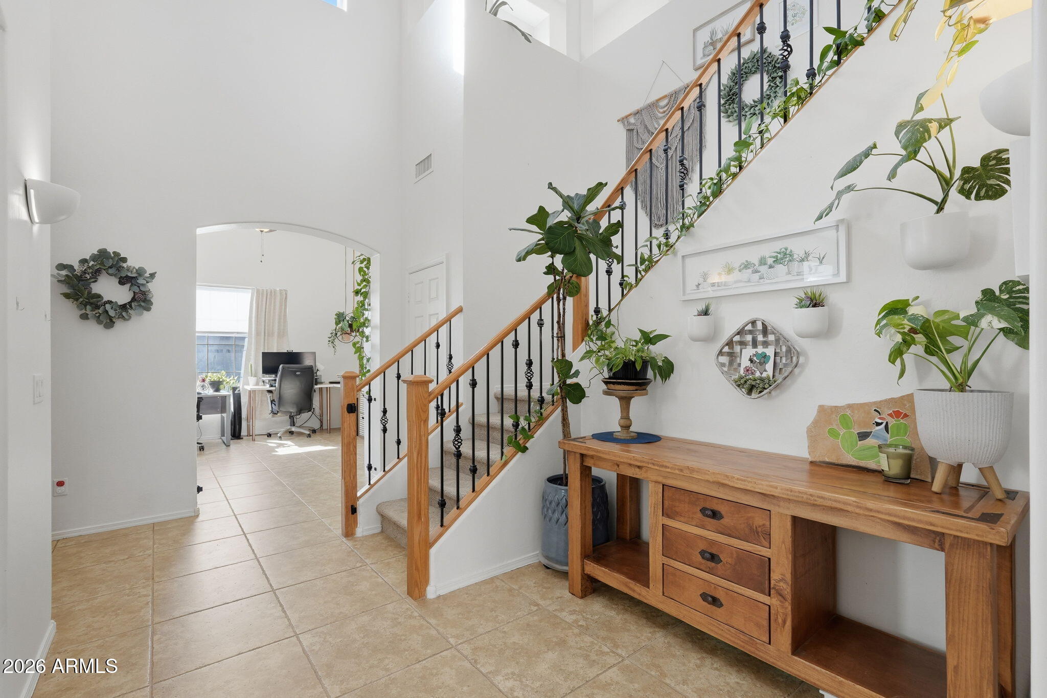 This is the kind of home that makes you pause the moment you see the Superstition Mountains stretching across the horizon. Set in the beautiful Gold Canyon area, this lovingly cared for home offers breathtaking views, privacy, and the kind of flexibility that fits real life, not just a floor plan.
Upstairs, you'll find three comfortable bedrooms, while downstairs offers two versatile flex spaces that can easily become additional bedrooms, a home office, gym, or creative space. Every bathroom and the kitchen have been thoughtfully updated, so the home feels fresh, stylish, and truly move-in ready. Pride of ownership shows in every corner. The backyard is a peaceful retreat with a larger, private lot and extra-tall surrounding walls that create a quiet, secluded feel. The pool becomes the perfect place to unwind, whether you're enjoying morning sun, hosting friends, or watching the mountains glow at sunset. Even the garage has a pleasant surprise, with a tucked-away third parking space or storage area you might miss if you're not looking for it.
Homes like this in Gold Canyon, with mountain views, privacy, updates, and flexible living space, don't come along often. This one is truly a gem and feels like a place you'll be proud to call home.