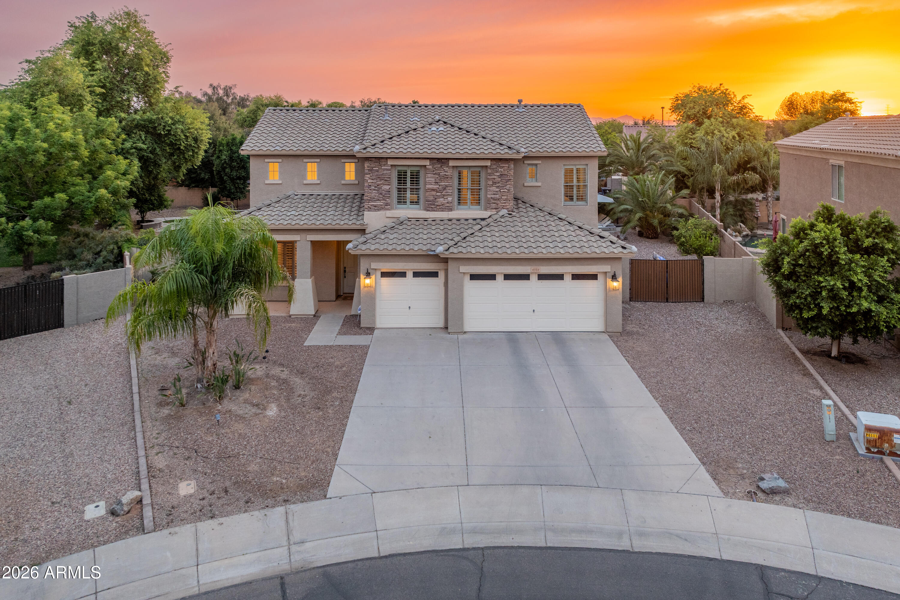 4984 S Cobblestone St isn't just another Gilbert home -- it's the one buyers hope exists when they start scrolling. Set on an impressive 12,000+ sq ft lot in one of Gilbert's most desirable areas, this home delivers the kind of space, function, and lifestyle that is getting harder to find. Step inside to beautiful white oak floors, 6-inch baseboards, and a layout that just makes sense: a downstairs primary suite for privacy and convenience, plus four generously sized bedrooms upstairs. The backyard is built for Arizona living with a sparkling pool, plenty of room to entertain, and space to breathe. Major updates are already handled with a newer roof, two newer AC units, and a solar lease that helps keep electric costs in check. Add in a 3-car garage, great curb appeal, and a location buyers already want and you have a home that checks the boxes without feeling basic. This is Gilbert living with room to grow, host, relax, and make a statement.