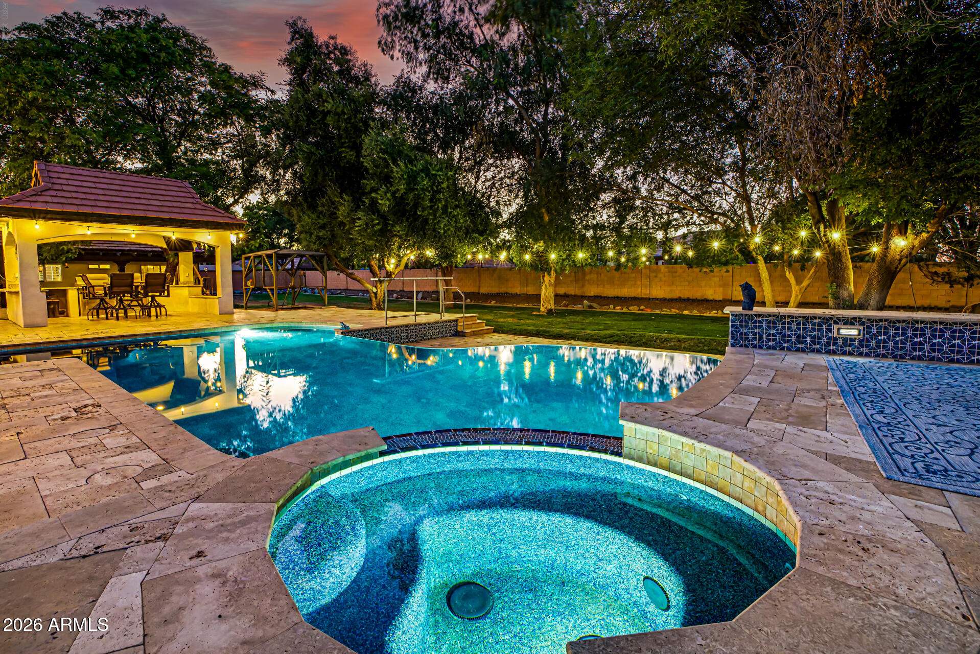 Separate guest house, RV GARAGES, 30k gallon diving pool-Experience the perfect blend of luxury, functionality, and resort-style living in this one-of-a-kind custom estate. Designed for both everyday comfort and entertaining, the beautifully remodeled open-concept kitchen is the heart of the home, featuring expansive workspace, premium finishes, and seamless flow into the spacious living and dining areas.

The single-level main residence offers 3 bedrooms, 2.5 bathrooms, and an exceptional floor plan filled with natural light. Car enthusiasts, hobbyists, and RV owners will appreciate the incredible garage and shop space, including an attached 5-car garage (configured as a 3-car garage plus an oversized RV or large truck bay) and a separate double-bay RV workshop with lift & oil change pi With room for up to 10 covered vehicles, this property is truly a rare find.
Guests or extended family will love the fully detached casita, complete with its own full kitchen featuring stainless steel gas appliances, private laundry, a remodeled walk-in shower, and a secluded patio--perfect for multigenerational living, visitors, or rental opportunities.
Step outside into your own private oasis. Mature shade trees, lush green lawns, and abundant landscaping create a setting that feels worlds away from the Arizona desert. Enjoy year-round outdoor living with commercial-grade misting systems, a BBQ ramada, an impressive in-ground smoker pit, and a spectacular infinity-edge diving pool and spa with a diving deck.
A grand circular driveway with a porte-cochère provides an elegant arrival and enhances the estate's impressive curb appeal.
This extraordinary property offers a combination of luxury, privacy, and unmatched garage capacity that is rarely available.

**Owner/Agent.**