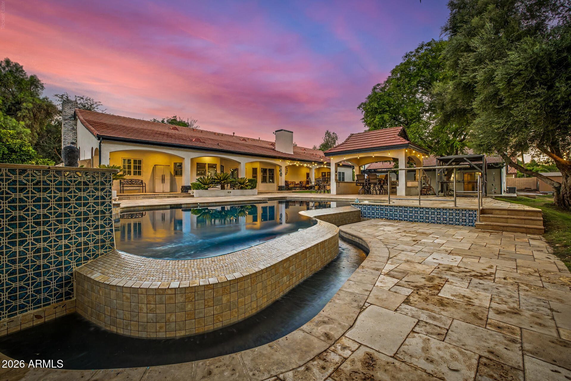 Separate guest house, RV GARAGES, 30k gallon diving pool-Experience the perfect blend of luxury, functionality, and resort-style living in this one-of-a-kind custom estate. Designed for both everyday comfort and entertaining, the beautifully remodeled open-concept kitchen is the heart of the home, featuring expansive workspace, premium finishes, and seamless flow into the spacious living and dining areas.

The single-level main residence offers 3 bedrooms, 2.5 bathrooms, and an exceptional floor plan filled with natural light. Car enthusiasts, hobbyists, and RV owners will appreciate the incredible garage and shop space, including an attached 5-car garage (configured as a 3-car garage plus an oversized RV or large truck bay) and a separate double-bay RV workshop with lift & oil change pi With room for up to 10 covered vehicles, this property is truly a rare find.
Guests or extended family will love the fully detached casita, complete with its own full kitchen featuring stainless steel gas appliances, private laundry, a remodeled walk-in shower, and a secluded patio--perfect for multigenerational living, visitors, or rental opportunities.
Step outside into your own private oasis. Mature shade trees, lush green lawns, and abundant landscaping create a setting that feels worlds away from the Arizona desert. Enjoy year-round outdoor living with commercial-grade misting systems, a BBQ ramada, an impressive in-ground smoker pit, and a spectacular infinity-edge diving pool and spa with a diving deck.
A grand circular driveway with a porte-cochère provides an elegant arrival and enhances the estate's impressive curb appeal.
This extraordinary property offers a combination of luxury, privacy, and unmatched garage capacity that is rarely available.

**Owner/Agent.**