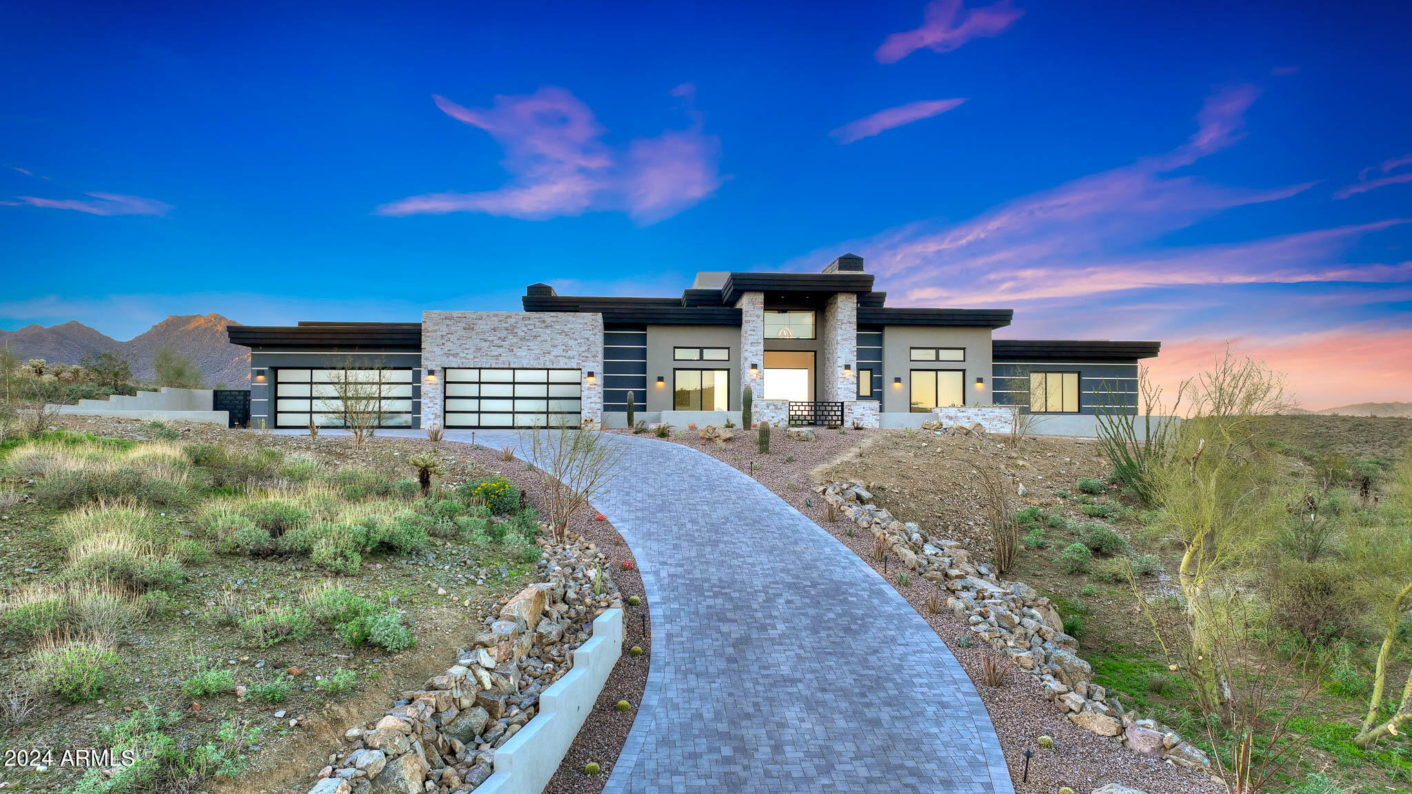 2024 NEW CONSTRUCTION. Gurczak Luxury Development is proud to present this New Construction Desert Contemporary Spec Home in the Exclusive Guard Gated Community of Eagles Nest. This 4,541 Sq. Ft. Home Features 3 Bedrooms w/ ensuite bathrooms & additional bonus rooms including a Game Room & Office. The shape and orientation of the home design takes advantage of the natural topography & North/South view corridors. The mixture of multi-colored
stucco, stone, and metal accents give varied texture and visual interest to the home, while the muted grey-tone colors allow the design to mesh with the landscape as well as sky when viewed from nearby angles.