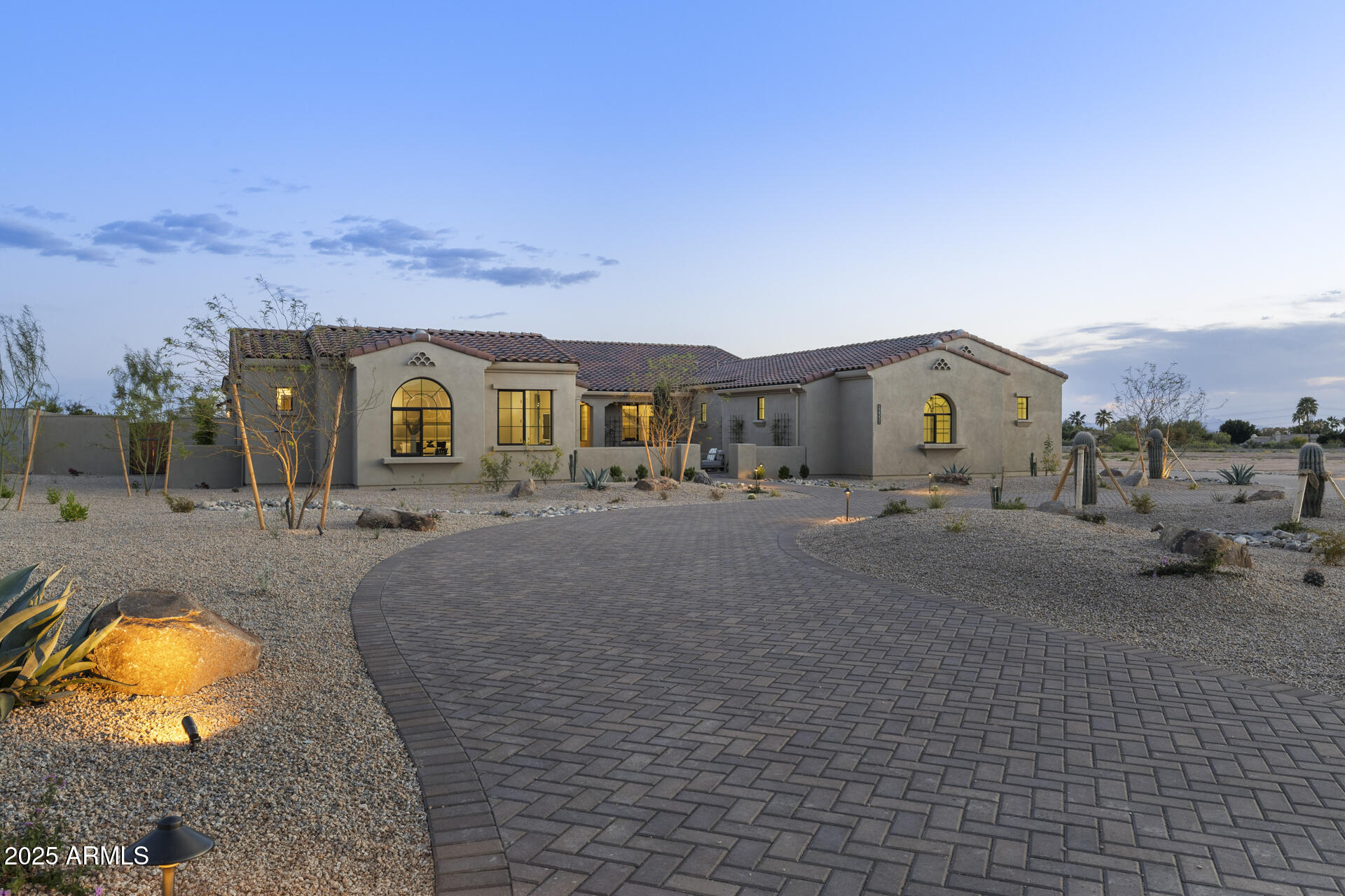 Welcome to this stunning, brand-new luxury Cachet Homes custom home in Emerald Hills, one of Scottsdale's most coveted neighborhoods in the Shea Corridor. With modern design and luxurious finishes, this home blends sophistication and comfort, all centrally located near Scottsdale shopping and entertainment. The bright, open-concept integrates the chef's kitchen, living, and dining spaces. The kitchen features top-of-the-line appliances, custom cabinetry, and a double island that opens to the family room. Natural light floods the living areas, highlighting the elegant wood floors and designer fixtures. The outdoor living area is truly a retreat and features a pool house, BBQ ramada, sparkling pool/spa, and spacious patio areas perfect for entertaining and enjoying the Arizona sunsets!