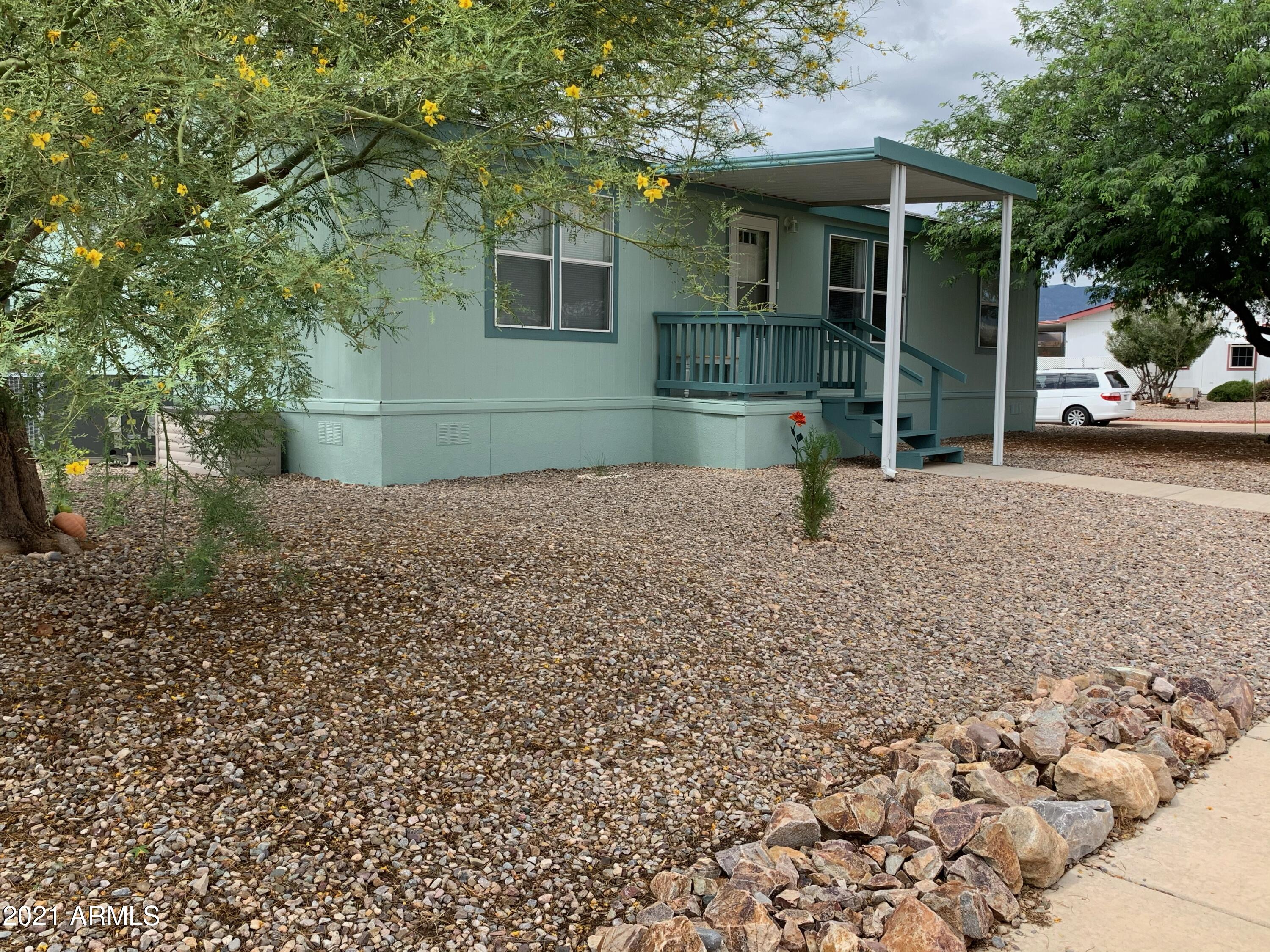 3 Bedroom (split plan), 2 bath, 1,232 square foot. Built in 2007. Immaculate, comfortable  home in a quiet, peaceful setting on almost a quarter of an acre corner lot. Enjoy beautiful, mature trees on this unique huge corner lot. New heat and AC in 2019. Newer laminate flooring. Lots of storage and pantry spaces, Roof is almost brand new. You will like the newly painted exterior. Gorgeous sunsets from your front porch. Mountains say hello each morning from your kitchen window. Relax at the community indoor pool and spa, showers, and outdoor pool too. also rec hall and clubhouse, putt putt golf, playground. Lots of activities sponsored by this park!