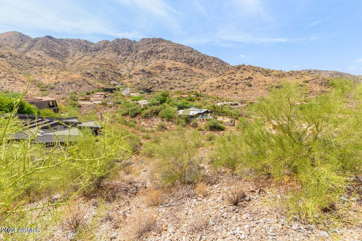 Location. Location. Location!!! An amazing luxury home-sight hidden in the hills in the heart of Paradise Valley's Sunset Hills awaits you! This quiet, serene hillside lot has panoramic views to the NE as far as the eye can see. Water, electric & natural gas are available to the property. Nestled conveniently close to local amenities, medical centers, and bustling markets, this is convenience and comfort rolled into one unbeatable package at an amazing value.