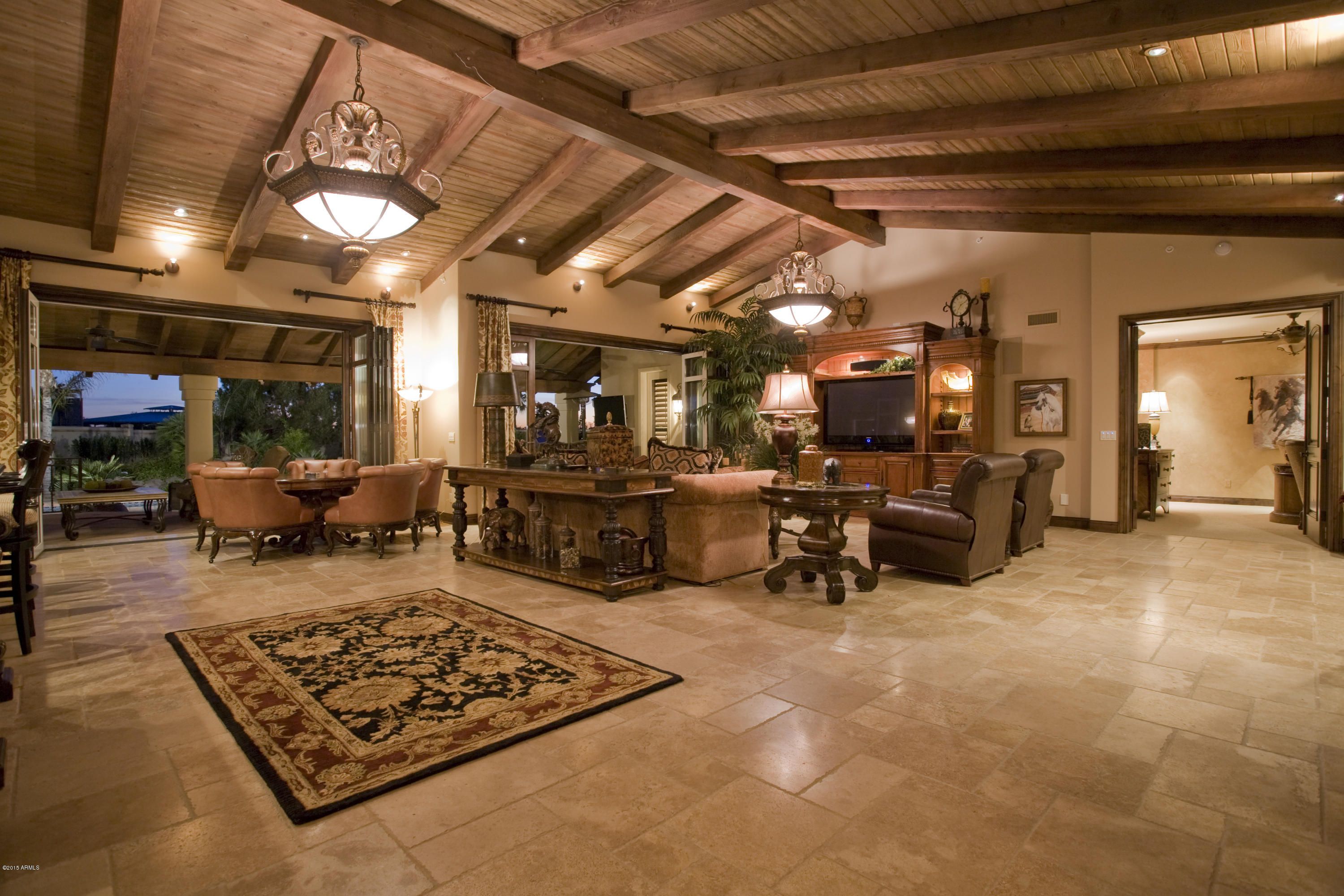 Incredible Equestrian Estate on 5+ acres, privately gated. Beautifully remodeled home & equine facility are consistent in style with soaring ceilings, timbered beams, exquisite hand-forged lighting & rich custom cabinetry. Resort backyard with tall palms, fruit trees, pool & spa, water features & built-in BBQ.  Barn contains stalls for 30 horses, groom rooms, wash racks & complete staff apartment. Outdoor facilities include arenas, Mare Motel, hot walker & breeding facility. One of a kind property!