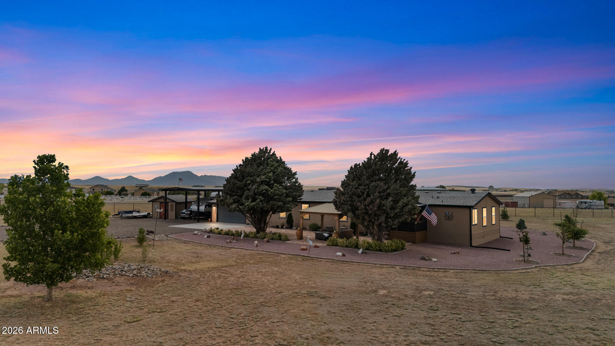 Enjoy wide-open space, breathtaking views, and a beautifully updated home on nearly 2 acres of usable land. This move-in-ready 4-bedroom, 3-bath property offers the perfect blend of privacy, comfort, and versatility. Inside, you'll find a thoughtfully renovated interior featuring designer-selected finishes and a highly desirable open-concept floor plan that creates a seamless flow between the living, dining, and kitchen areas. The stunning kitchen showcases quartz countertops, new cabinetry, and ample workspace for cooking and entertaining. Both the kitchen and bathrooms have been beautifully updated with new cabinets, while the remodeled bathrooms offer modern finishes and a fresh, contemporary feel. Large windows fill the home with natural light while framing the surrounding mountain and high-desert scenery. Step outside to two spacious decks, ideal for enjoying Arizona's spectacular sunsets, entertaining guests, or simply taking in the peaceful surroundings. A new HVAC system provides year-round comfort and energy efficiency. Designed for those who need room to live, work, and play, the property includes an impressive industrial-height RV carport along with ample space for RVs, trailers, off-road vehicles, horses, and additional equipment. Whether you're seeking an equestrian-friendly property, a place for all your toys, or simply extra elbow room away from the city, this property offers endless possibilities. Rarely does a property combine modern updates, usable acreage, exceptional views, and extensive vehicle storage in one package. Experience the freedom, flexibility, and outdoor lifestyle that Northern Arizona living is all about.