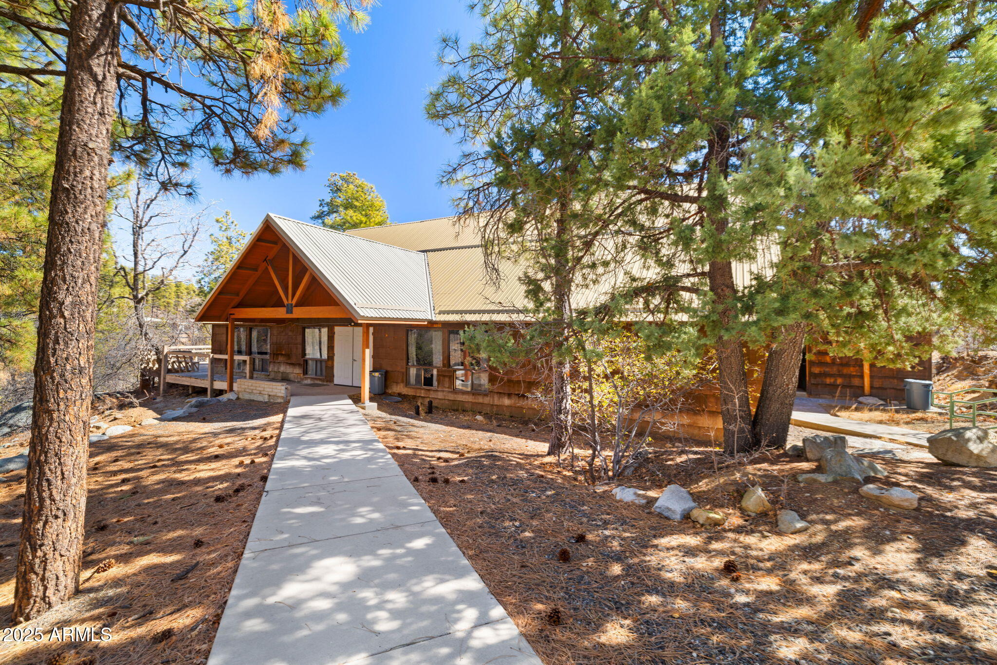 Life-Changing Camp in Prescott-Ideal for Nonprofits & Investment. A turnkey 60-acre retreat in the Prescott National Forest, designed for nonprofits, faith-based organizations, and leadership programs. This fully equipped property offers a separate worship lodge, a spacious dining hall with a commercial kitchen, and 16 total cabins (14 private cabins w/ bathrooms + 2 ADA-compliant cabins). Recreational amenities include a high-adventure ropes course, full-size soccer field, basketball court, paintball course, and an outdoor amphitheater, creating an ideal space for leadership training, team-building, and large-group retreats. With infrastructure in place to host large-scale programs, camps, and conferences, this property is a rare opportunity for a purpose-driven investor or organization.