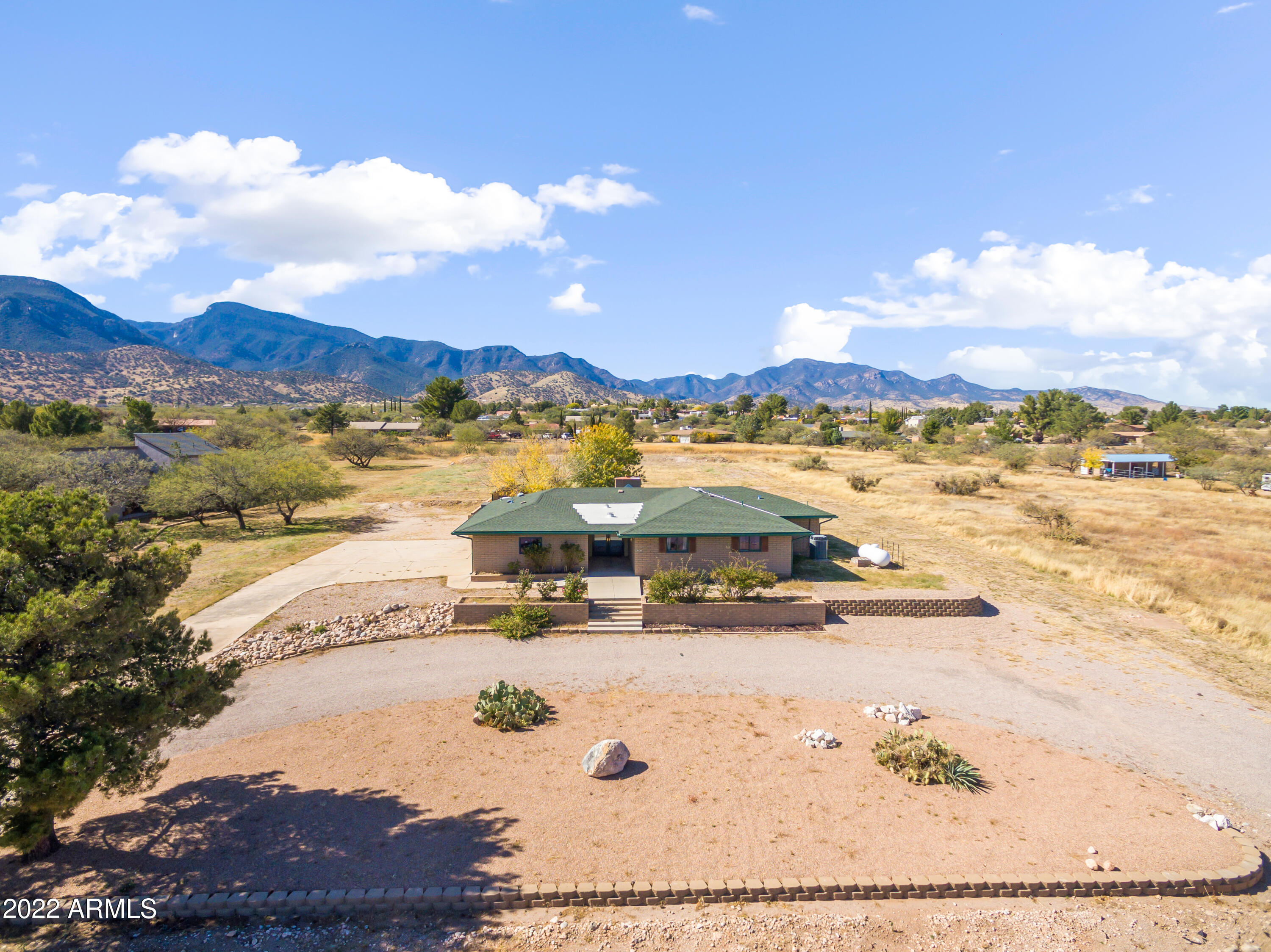 Perfectly maintained home nestled in the beloved neighborhood of Pueblo Del Sol One because of the larger lots, spectacular mountain views, and quite living. This home is no different. Sitting on the west side of Apache Ave and the house sitting up in elevation you get all that and so much more. Sitting on 1.38+ acres there is room to roam. Kitchen is spacious eat in kitchen style with plenty of room for cooking and dining. Living room has a fireplace as its center piece (currently gas is capped- not in use). Primary bedroom was expanded to make a much larger walk in closet. On-suite is extended as well. Water softener and HVAC have filtration systems and UV lights for added protection from impurities. I know you can't wait to see this one, make your appointment today!!