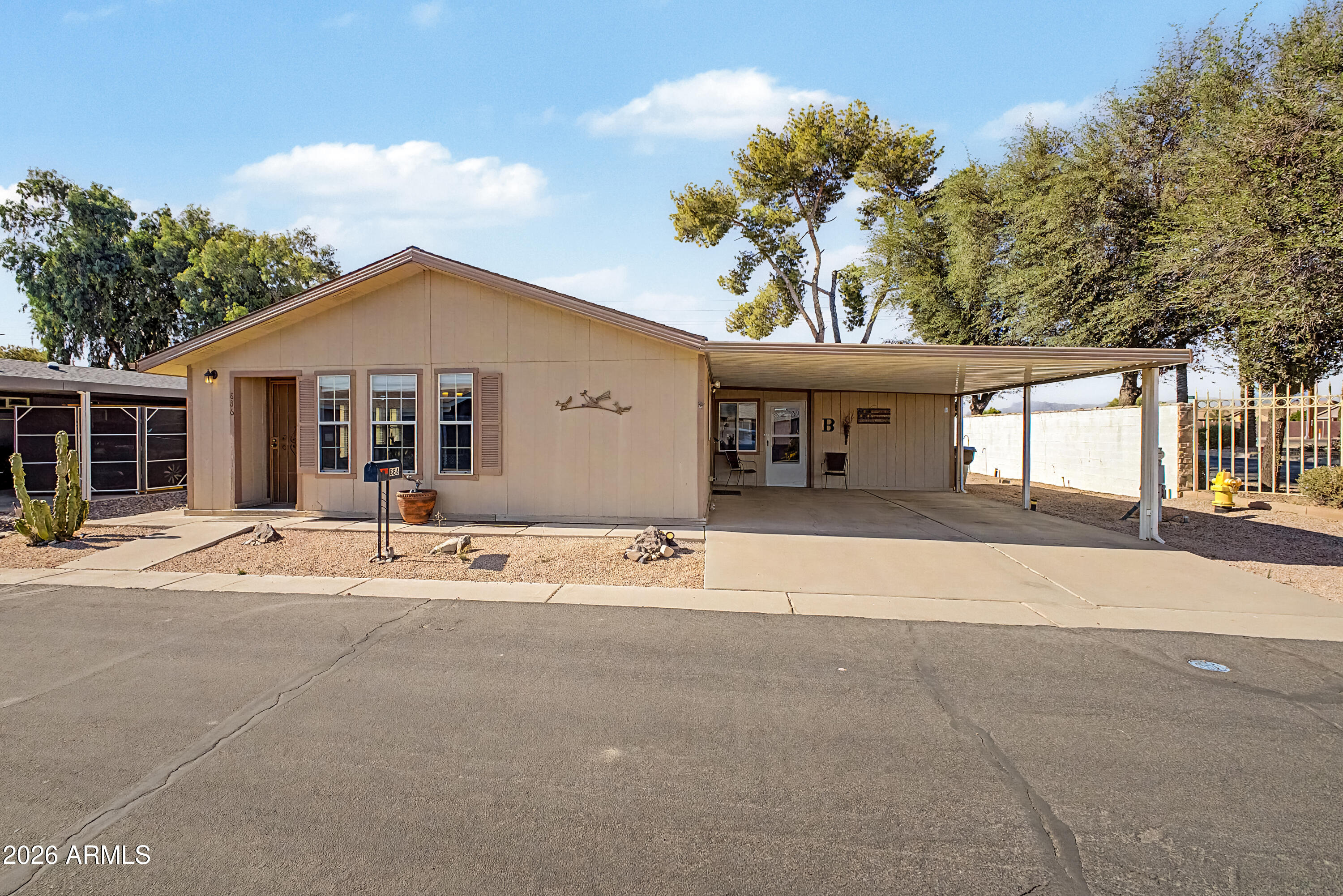 Links Estates-Well Maintained-Move in Ready-Furnished-2 bed 2 bath single level manufactured home on owned land. Vaulted ceilings with great room floorplan. This home is in great condition and just needs a new owner. Lots of storage and even has an Arizona room which could be used for office or hobby room. Community offers heated pool, clubhouse. Tons of shopping,restaurants and medical services close by.