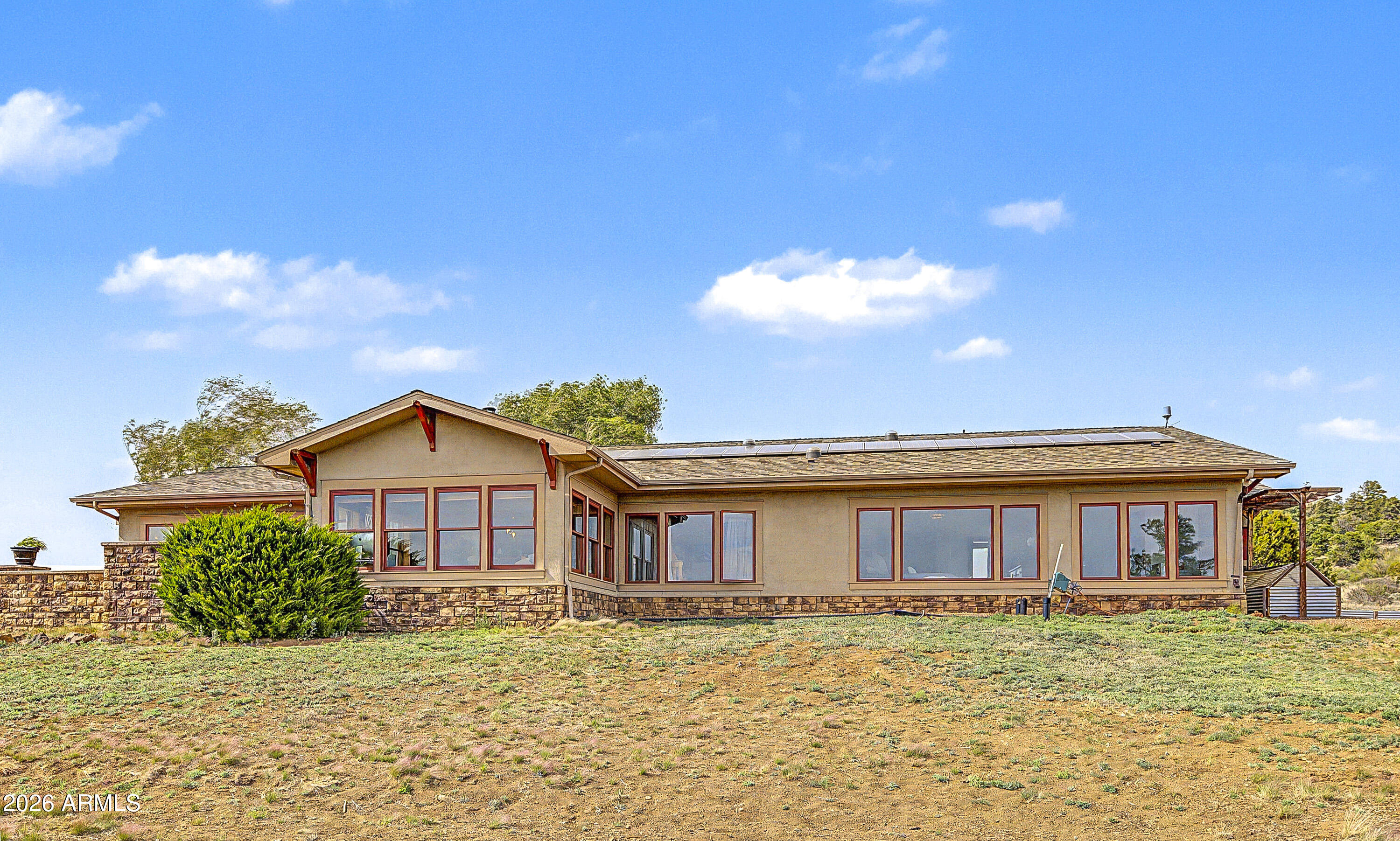 Imagine a peaceful retreat--expand your vision to this high-investment property: TWO parcels of land bordering the National Forest in ONE Estate! Privacy and adventure await! Ride horses on scenic trails, feeling nature's calm and wonder all around you. Step inside this home, built for comfort and sustainability. 10'' Rastra Block construction keeps the house cool in the summer and warm in the winter. Gathered by the efficient wood stove, heating the whole home on winter nights. Bask in sunlight streaming through every window, lighting each room. Create lasting memories in a kitchen designed for togetherness. Custom Cherry Cabinets, New GE Cafe Appliances.Corals, Coops, Storage Buildings, Gardens, True Country living! Custom Woodworking, glass lighting, add to this Craftsman Style House.