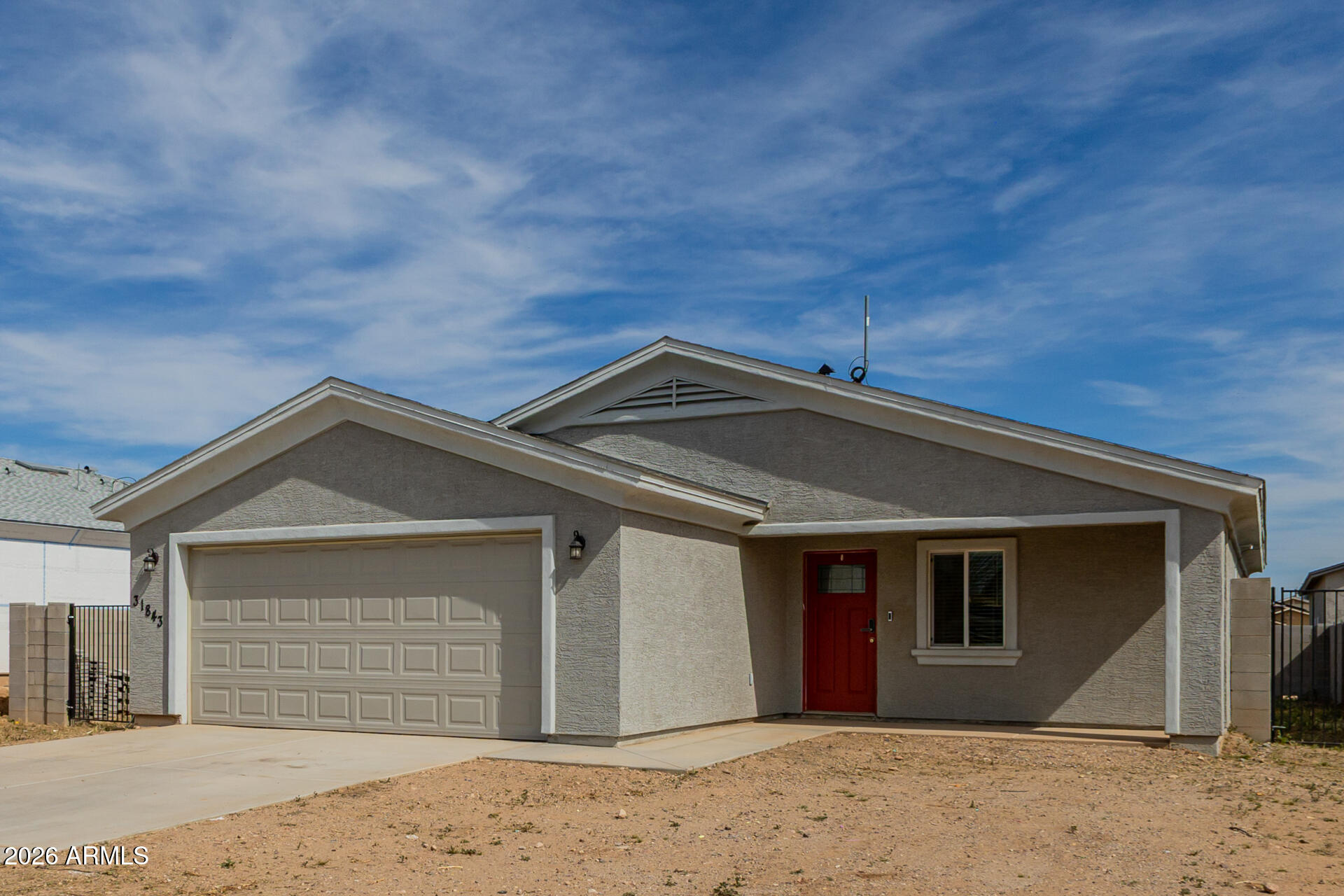 Built in 2023, this modern 3-bedroom, 2-bath home offers the space and freedom buyers love in Wittmann -- with NO HOA. The open-concept layout features tile flooring throughout and a stylish kitchen with sleek finishes and ample cabinet space. Spacious living and dining areas create an inviting space for everyday living or entertaining. The private primary suite includes a well-appointed bath and generous closet space. Outside, enjoy a block-fenced backyard with an RV gate and extra parking. Move-in ready with energy-efficient construction and modern upgrades throughout.