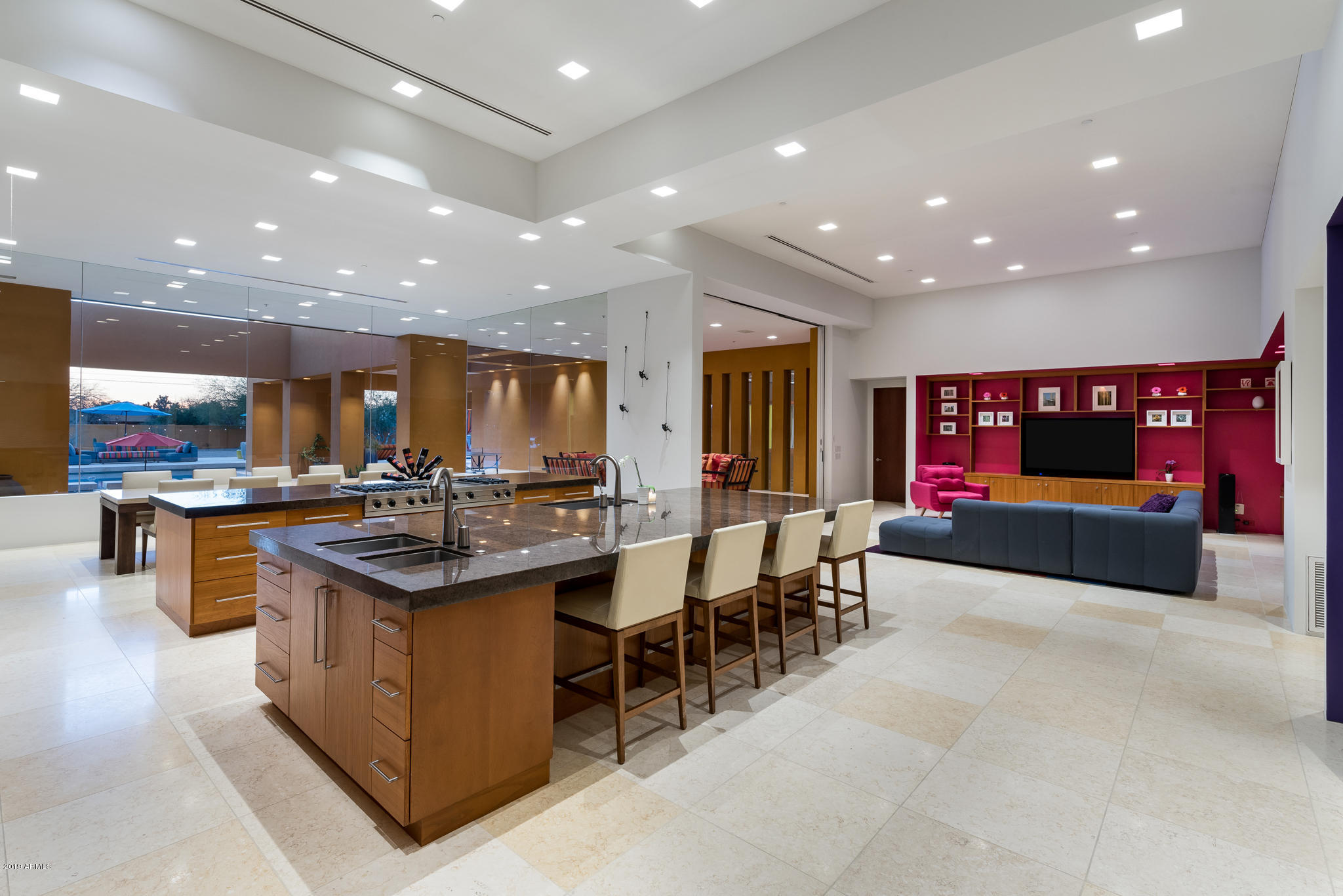 This stunning Mexican contemporary was inspired by renowned architects Legorreta and Barragan. The outstanding use of architectural detail provides incredible natural light, clean lines and an open floor plan that is perfect for entertaining. The great room has a dramatic wall of glass looking out over the resort-like backyard with pool and 2500 square feet of covered limestone patio. The kitchen features Viking appliance package with 6 burner gas rangetop and griddle, 2 dishwashers, 2 islands, 3 sinks, 2 ovens including an Infrared oven, and 2 oversized walk-in pantries. Other features of the home include an impressive crushed limestone wine cellar with barrel vaulted ceiling, a multi-level movie theatre, an in-home gym, and an attached pool house. Come experience your own paradise!