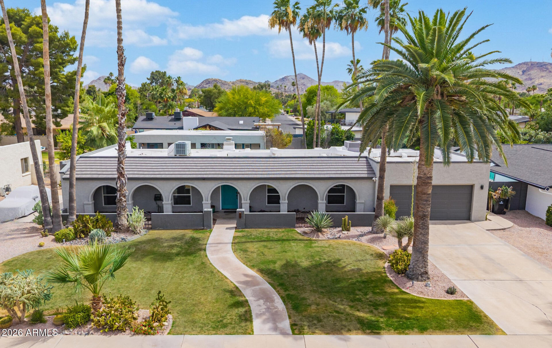 Exceptional fully remodeled Moon Valley stunner featuring a main residence with 2,515 sqft and an expansive detached guest house offering an additional 1,191 sq. ft. of flexible living space -- all situated on an oversized 1/3-acre lot with no HOA. The main home offers 4 bedrooms & 3 full bathrooms while the guesthouse offers 2 bedrooms, a full kitchen and bathroom plus a spacious living room. Inside, the extensively renovated main home blends timeless character with modern luxury. The gourmet kitchen is the centerpiece of the home, showcasing custom cabinetry, striking waterfall-edge quartz countertops, premium upgraded appliances, and the added convenience of a butler's pantry and adjacent laundry area. Thoughtfully designed split primary suites offer ideal flexibility, including one en-suite with its own private entrance and sitting area -- perfect for guests, multi-generational living or a private office setup. Additional upgrades include tankless water heaters,  solar tubes providing abundant natural light, raised ceilings, smart home features, extensive custom finishes and quality craftsmanship throughout.

From the moment you arrive, the meticulously maintained landscaping, mature shade trees, and inviting curb appeal set the tone for this truly special property. The backyard is designed for both entertaining and relaxation with a diving pool, lush grassy areas, generous patio space, and a private resort-style atmosphere you expect to find in Moon Valley.

The detached guest house is a standout feature with its own private entrance. Ideal for extended family, guests, or income potential, the guest house has previously operated successfully as an Airbnb generating approximately $42,000 annually. Private entrance to guest home at side yard next to RV gate. Furnishings available by separate bill of sale. This is a rare opportunity to own a truly amazing Moon Valley property where every detail has been carefully curated and upgraded. Just minutes from Moon Valley Country Club and Lookout Mountain. Don't miss this one!