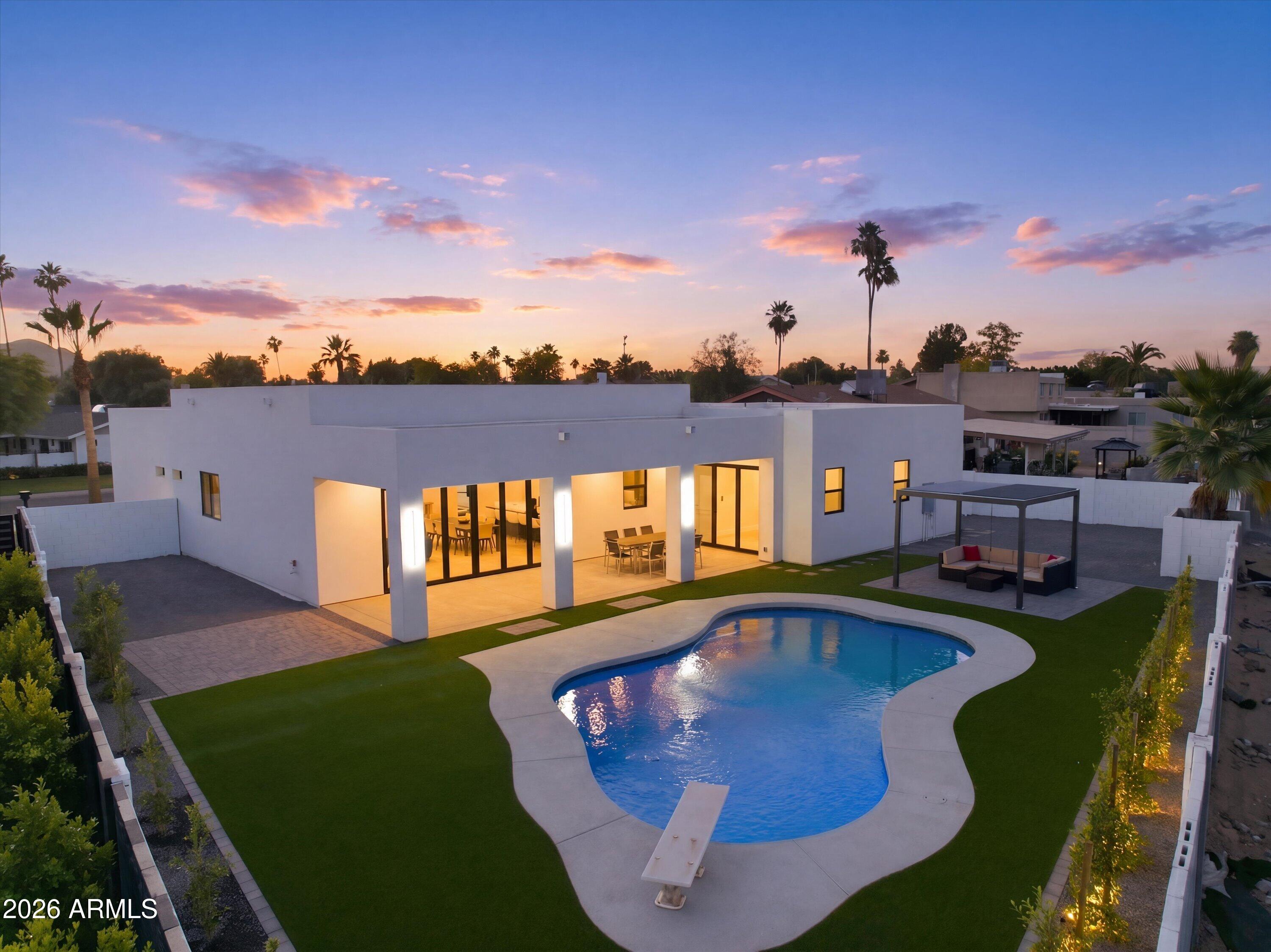 3000+ SF extensively rebuilt home on a quarter-acre lot with soaring over-height ceilings and designer finishes throughout. Features slim white oak cabinetry, engineered hardwood flooring, and stunning Taj Mahal waterfall countertops. Spacious open-concept floorplan offers 5 bedrooms and 4 bathrooms. Oversized over-length garage with EV charging and RV parking. Premium Thermador smart appliance package included. No HOA. Large lot with room for entertaining, toys, or future additions.
Nearly everything is new -- approximately 1,200 SF was added during the rebuild. Roof and trusses were completely reconstructed with raised ceiling heights to create the dramatic modern interior feel. All new plumbing, electrical, windows, drywall, flooring, and finishes throughout.