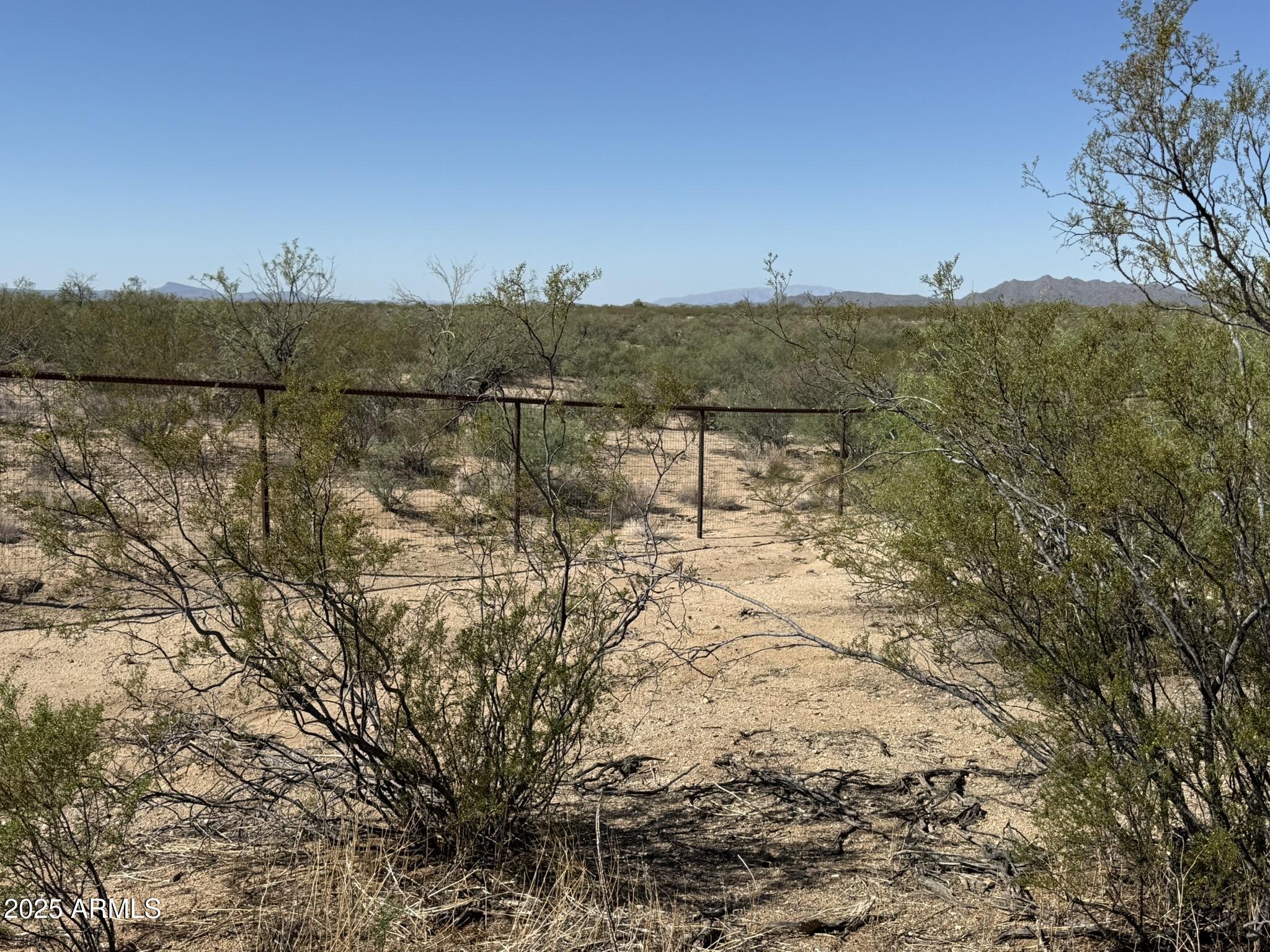 Beautiful 8 acre land parcel just 20 minutes from Wickenburg!!! Great views!!! Fully fenced with pipe and no-climb!! Shared well and electricity close by!! Perfect ranch and horse property for building your dream facility!! Level and ready to go!!