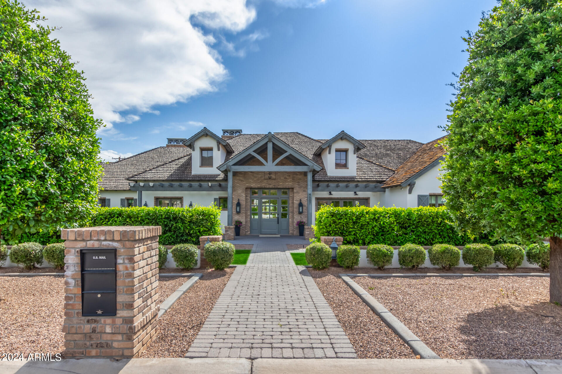 Prepare to be amazed! Come and see this wonderful 5 bed, 6.5 bath residence now on the market! A stunning facade w/brick veneer accents, manicured landscape w/lush grass areas, a 3 car garage, paver driveway & walkways, and an RV gate are just the beginning! Discover a lavish interior boasting vaulted ceilings w/exposed wood beams, elegant wood-look flooring, dazzling light fixtures, and trending palette throughout. The formal dining room, w/its stylish French doors and wet bar, is perfect for hosting a dinner party! Continue into the spacious living area, featuring an impressive brick fireplace to keep you warm during the winter months. The kitchen is a chef's dream come true, comprised of ample cabinet & counter space w/subway tile backsplash, built-in appliances, farmhouse sinks, a walk-in pantry, an island w/a breakfast bar, and a lovely breakfast nook. Relax and unwind the primary bedroom, showcasing custom wainscoting, direct outdoor access, a 2nd fireplace, a walk-in closet, and a luxurious ensuite w/dual sinks & a garden tub. Additional bedrooms all include private baths as well! Let's not forget about the HUGE loft w/a 2nd wet bar, ideal for a game room or lounge area. You'll also find a mud room and an adjacent laundry room equipped w/tons of built-in cabinets and a convenient utility sink! Finally, the wonderful backyard includes a covered patio, extended seating areas, in-ground trampoline, and a sparkling blue pool/spa combo! This is the opportunity of a lifetime, don't let it slip by!