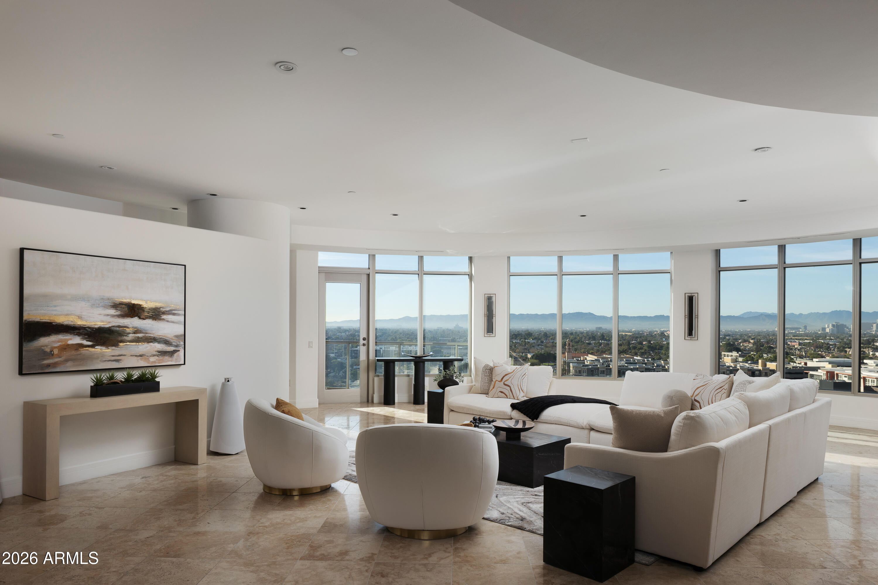 Commanding the very top tier of luxury living at Esplanade Place, Penthouse 2 represents the largest residence available in the building and a truly rare offering within the Arizona condominium market.  Encompassing nearly 4,300 sq. ft, this extraordinary penthouse delivers a level of scale, privacy and presence more commonly associated with a custom estate- reimagined in a premier high-rise setting. Designed for those who seek both space and sophistication, the residence is complemented by three dedicated parking spaces and a substantial private storage unit, providing exceptional convenience rarely found in condominium living.  From this elevated vantage point, the home enjoys breathtaking ''top of the world'' views stretching from South Mountain and sparkling downtown city lights to the renowned Biltmore corridor, creating a dramatic and ever-changing panorama both day and night.  Esplanade Place enhances this singular offering with 24-hour guard-gated security, professional-grade services and a full suite of resort-style amenities including valet service for residents and guests, a rooftop pool with entertainment terraces and grills, an expansive club room adn state-of-the-art fitness center.  With direct access to the Biltmore shopping and dining district and immediate proximity to the area's newest acclaimed restaurants, Penthouse 2 delivers a lifestyle defined by scale, service and unmatched urban luxury.  This is more than a residence- it is a statement property, unrivaled within the building and nearly impossible to replicate anywhere else in the market.
