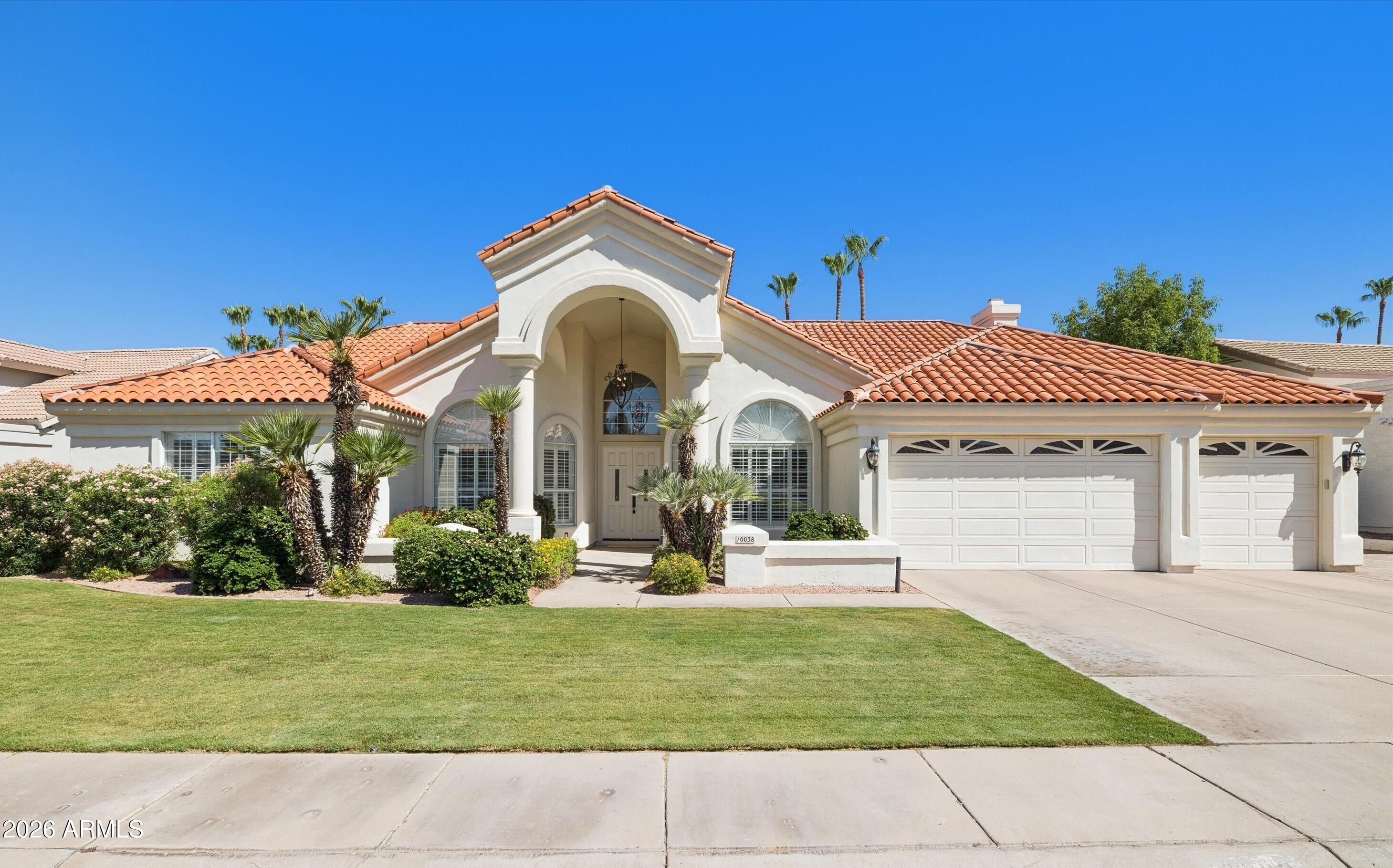 RARE FIND! Welcome to Powderhorn Ranch, a highly sought-after enclave of custom homes in the Cactus Corridor.  Fantastic floor plan with great flow, soaring ceilings, 4 spacious bedrooms, 2.5 baths, & 3-car garage. MOVE-IN READY: Neutral interior with stone flooring, granite countertops, updated cabinetry, wood shutters & all-new designer lighting. The primary suite is a dream w/ fireplace, sitting area, & updated bath w/ spacious walk-in closet. New roof & newer AC. Expanded parking. OUTDOOR OASIS: Outdoor living with an ultra-private backyard, sparkling pool/spa, BBQ, misters, and built-in dining table w/ fire feature. PREMIER LOCATION: This unrivaled location in the heart of Scottsdale is just minutes to dining, recreation, top-rated schools & Loop 101. Furniture available separately.