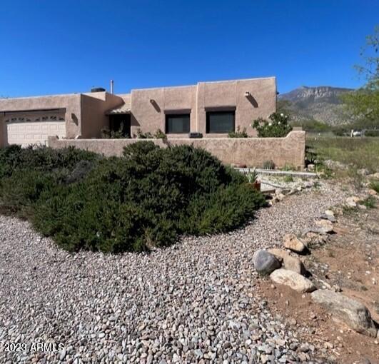 Great home in the country but close enough to drive to Sierra Vista or Bisbee in short time. Fantastic floorplan and amazing mountain views! Add some TLC and this may be the perfect home for you. Call for a private tour today.