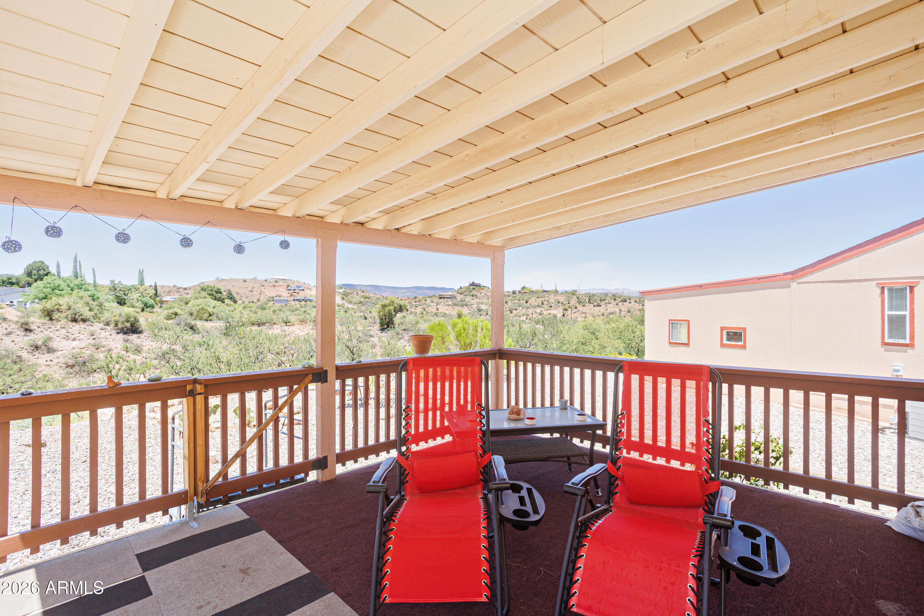Perimeter Lot with Stunning Views!
This adorable home is truly a ''cutie'' and has been lovingly maintained. Situated on a desirable perimeter lot, you'll enjoy breathtaking views--watch the colorful hot air balloons over Sedona in the morning and the sparkling lights of Jerome in the evening.
Inside, you'll find a comfortable layout with 2 bedrooms, 2 full bathrooms and the convenience of a stackable washer and dryer. Relax on the spacious back porch, perfect for taking in the scenery and Arizona sunsets. Storage is plentiful with an 8' x 8' x 8' storage shed plus additional storage at the front porch. Located in a welcoming, amenity-rich community, residents enjoy two heated swimming pools, pickleball, bocce ball, and countless social activities and events. Priced for quick sale.