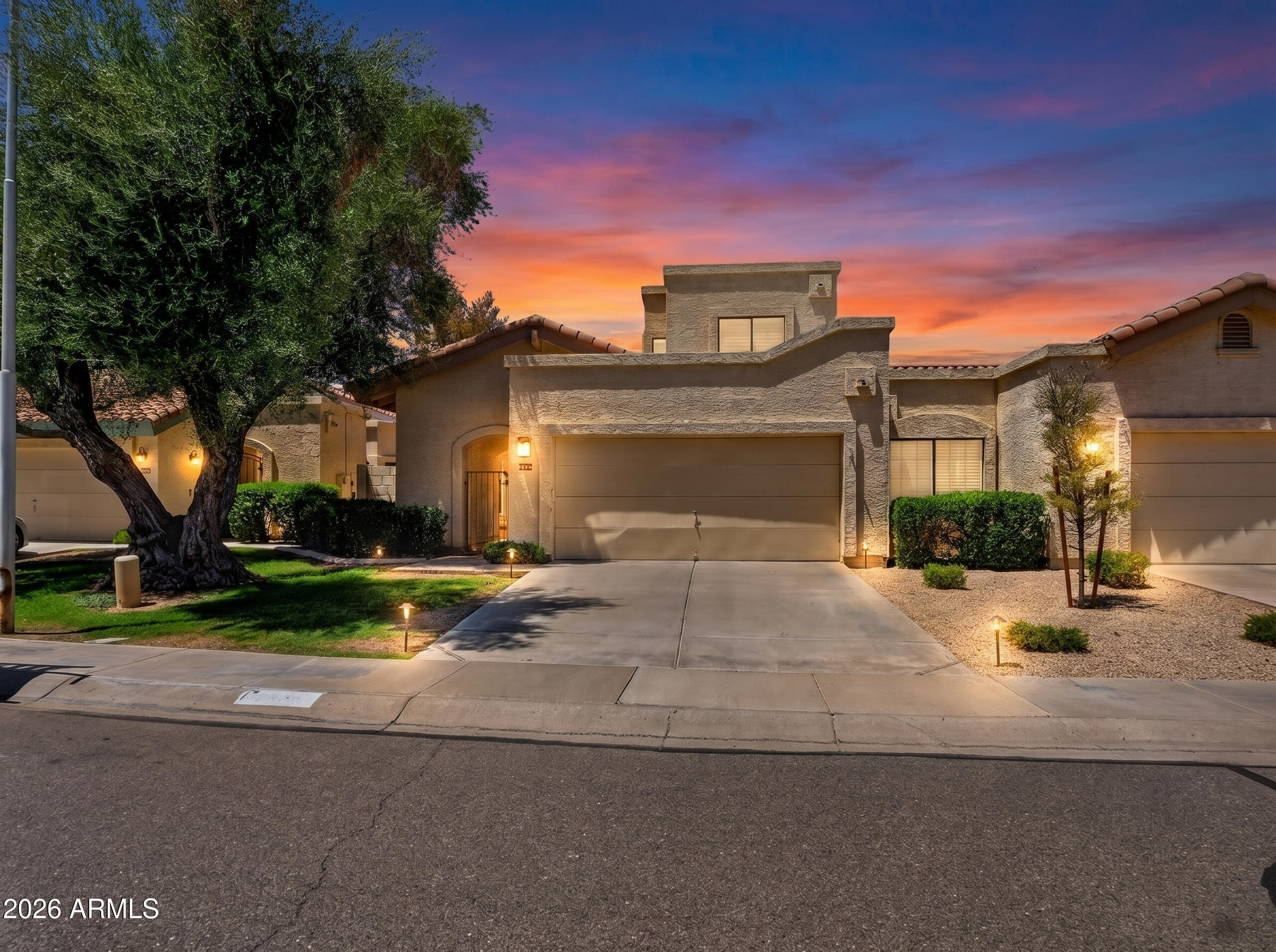 Two primary suites • Enclosed den with 3/4 bath • Lock-and-leave lifestyle. Heatherbrook Square in Chandler. 1,708 SF, one shared sound-barrier wall, vaulted ceilings, wood-burning fireplace, and original plantation shutters. Dual primary suites on separate levels, each with a private bath. Enclosed den with doors and adjacent 3/4 bath; ideal as a home office, gym, or guest space for a bonus 3rd bedroom. New LVP flooring (2022), interior paint (2022), and fully enclosed backyard, brick paver patio, mature trees, sprinkler system, & storage shed. Major updates: roof (2022), HVAC (2019), water heater (2021), kitchen appliances (2022-2024), and plumbing refresh (2022). HOA maintains the front yard. Community pool, spa, pickleball, tennis, and basketball courts. Loop 101 within 0.5 mi.