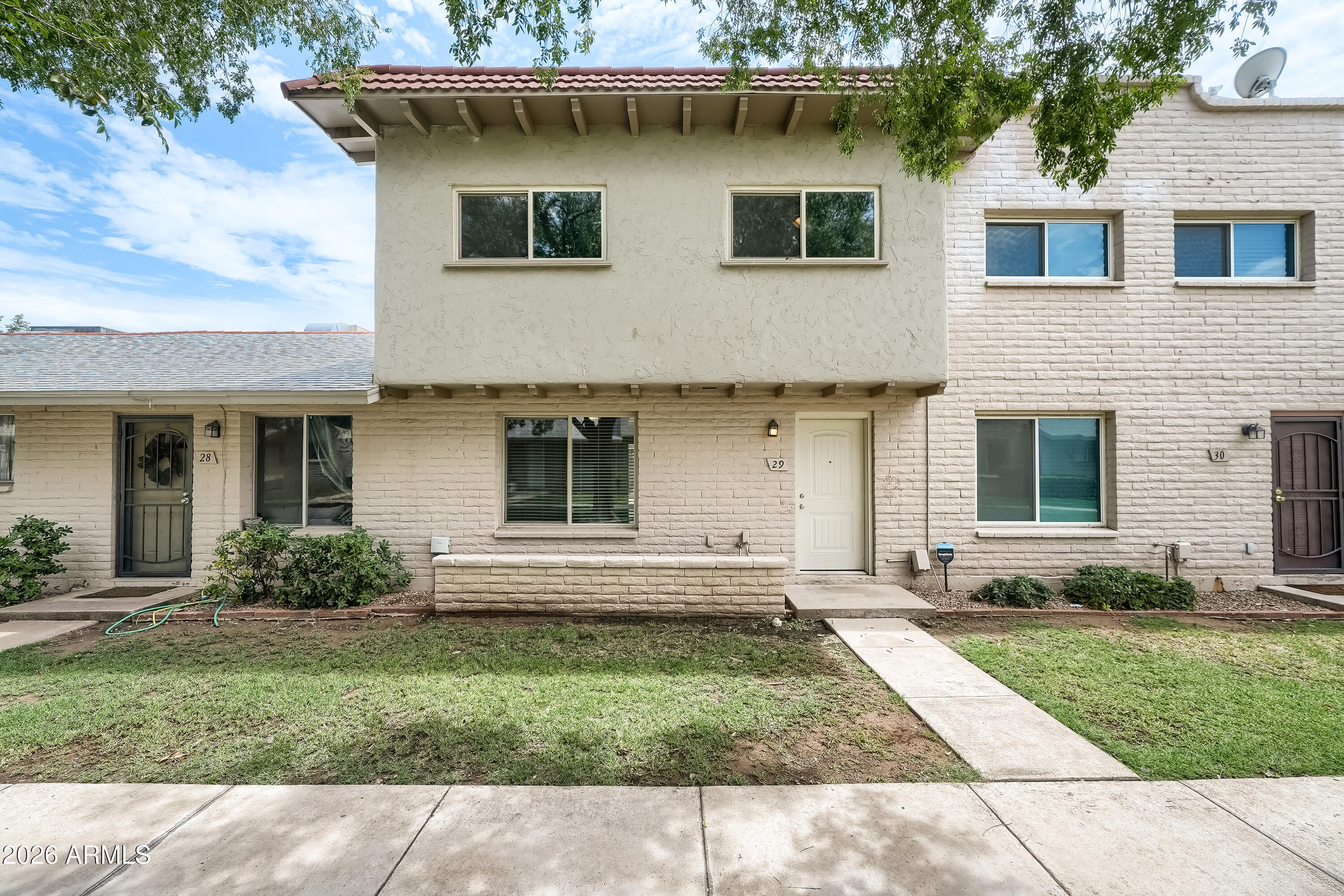 Welcome home to this spacious and inviting 4-bedroom, 2.5-bath townhouse nestled in the heart of Mesa. From the moment you step inside, you'll feel the comfort and warmth of a home designed for making memories. With 1,518 square feet of thoughtfully designed living space across two stories, there is room to spread out, entertain, and enjoy everyday living.
The main level features a spacious separate living area with a welcoming atmosphere, complemented by a light and bright kitchen with stainless steel appliances and a separate dining area perfect for family meals or gathering with friends. A generously sized laundry room with washer and dryer hookups adds everyday convenience. Upstairs, you'll find all four bedrooms, creating a private retreat away from the main living quarters, and offering the perfect opportunity to personalize the space with new carpeting or flooring to suit your style and taste.  The home also boosts new windows throughout, complete with a 3-year warranty, providing comfort, efficiency, and peace of mind. A newer A/C system adds to the year-round comfort of this beautiful home.
Step outside to your private, spacious patio with a storage shed -- the perfect place for enjoying Arizona evenings, outdoor dining, or additional storage. The property also includes three reserved parking spaces, including one covered space.
The community offers an exceptional lifestyle with an oversized Olympic-size pool and a fantastic clubhouse, providing great spaces to enjoy with family and friends. The location is ideal, with convenient access to the light rail, ASU, shopping, dining, and entertainment.
The HOA includes water, sewer, and garbage collection, adding value and convenience while making everyday living easier.
With its spacious floor plan, thoughtful upgrades, private outdoor space, resort-style amenities, and prime Mesa location, this townhouse offers the perfect blend of comfort, convenience, and lifestyle. This isn't just a place to live -- it's a place to call home!
