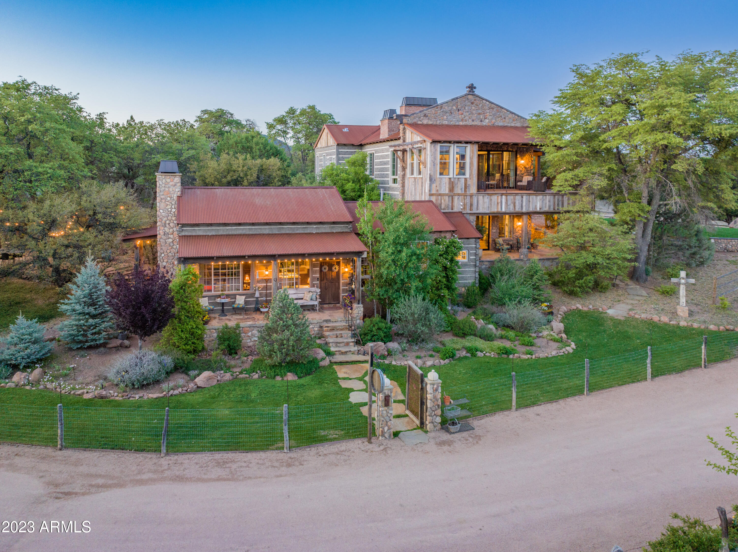 Once in a Lifetime Opportunity! Welcome to this stunning property in the high country of Arizona where an exceptional 14 acre working vineyard awaits you. Boasting a rich history, this property has served as a highly acclaimed Bed and Breakfast and would wow the Airbnb unique site seeker, catering to discerning guests seeking an unforgettable retreat. Every detail of this remarkable estate has been crafted with the utmost care and highest quality. From the stunning vineyard to the thoughtfully designed living quarters, no expense has been spared in creating an atmosphere of refined elegance. Within the estate, you will find three separate living quarters, each offering its own unique charm. The first residence features two spacious bedrooms and three full bathrooms, ensuring luxurious comfort for its occupants

The Guest House offers a cozy haven with two bedrooms and a shared bathroom, inviting tranquility and relaxation. Completing the ensemble is the garden house, a delightful one-bedroom, one-bathroom sanctuary nestled amidst the captivating surroundings.

In addition to the vineyard and living quarters, the property encompasses 1.5 acres of fenced pastured land, perfect for grazing animals. The property also holds multiple areas for gardening. One was designed with beautiful raised stone beds and the additional gardens are located within the vineyard, all fenced. This expansive estate presents endless possibilities for those seeking a sustainable lifestyle immersed in natural beauty. Should we mention two high producing water wells and a completely irrigated property? Loads of fruits trees too!!

Experience the perfect fusion of rustic tranquility and exquisite craftsmanship at this extraordinary Young, AZ vineyard. Whether you continue its legacy as a bed and breakfast or transform it into your private sanctuary, this property promises an unparalleled living experience. Indulge in the finest quality and embrace a life that blends sophistication with the beauty of nature. The opportunity to call this vineyard retreat your own awaits you.