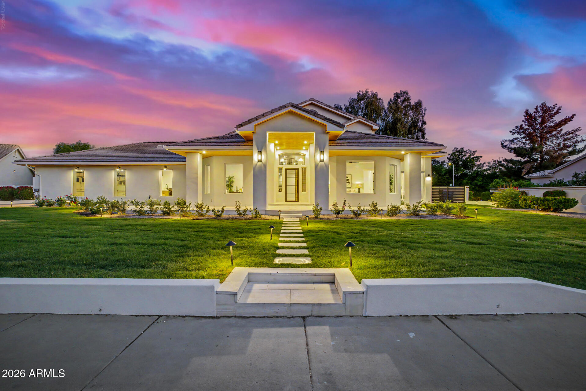 Welcome to 1321 W. Gardenia Avenue, an exceptional North Central Phoenix residence where timeless design meets modern luxury. Recently remodeled from top to bottom, this stunning home offers 5 bedrooms, 5.5 bathrooms, a dedicated office, an expansive upstairs loft, and sits on a 16,000+ square-foot lot designed for seamless indoor-outdoor living. Soaring ceilings, abundant natural light, and designer finishes create an inviting atmosphere throughout.

At the heart of the home, the gourmet kitchen features marble countertops with a full-height marble backsplash, premium Viking and Bosch appliances, a spacious walk-in pantry, new blonde hardwood flooring, and overlooks the open-concept living and dining spaces. A dramatic wrought-iron staircase serves as a striking architectural centerpiec The spacious primary suite offers a private sitting area, spa-inspired bath with a soaking tub, dual-head walk-in shower, oversized closet, and the convenience of its own laundry. Every secondary bedroom includes a private en-suite bath with an oversized walk-in shower, providing comfort and privacy for family and guests. Upstairs, the versatile loft creates the perfect space for a media room, homework station, game room, or teen retreat.

Designed for Arizona living, two oversized multi-slide glass doors open to a spectacular 600+ square-foot covered patio accented by exposed beam detailing. White limestone hardscaping, lush mature landscaping, custom lighting, and a full irrigation system create a resort-style backyard built for year-round entertaining.

Additional highlights include updated HVAC systems, a three-car garage with epoxy floors, and dual laundry areas for everyday convenience.

Residents enjoy a neighborhood green space with a large open field and a gated sports court featuring basketball, pickleball, and tennis. This move-in-ready home is a rare opportunity to own a beautifully renovated property in one of North Central Phoenix's most sought-after neighborhoods.
