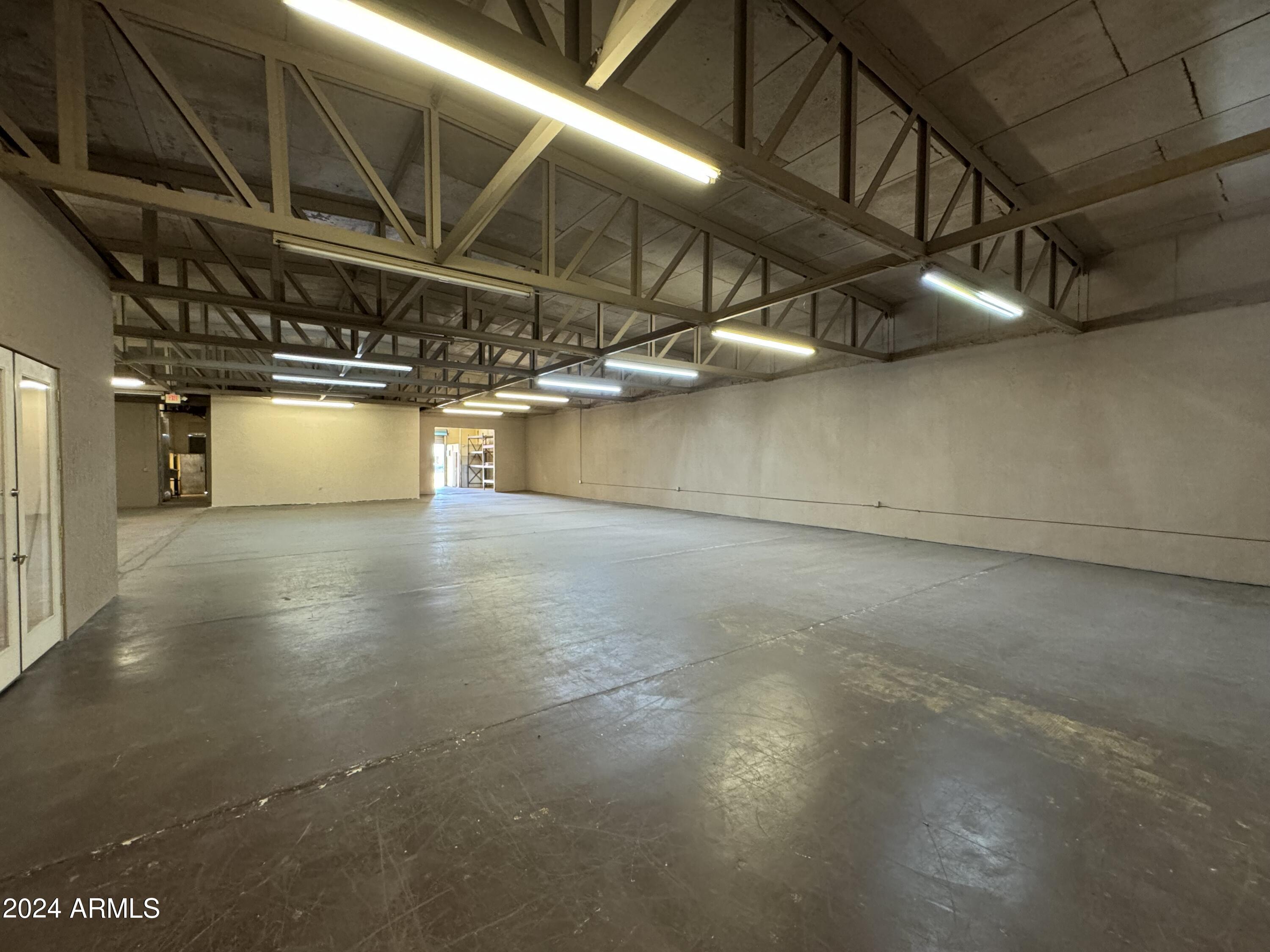 Versatile commercial property offering a well-balanced combination of office, warehouse space and storage. 

The primary Warehouse delivers an efficient blend of professional and industrial functionality. Approximately 2000 square feet of dedicated office space with 2 restrooms and storage areas. An additional 1,000 sqft of flex space with dedicated entrance that offers 1 restroom, storage and a commercial kitchen. The remaining 6,000 square feet of open-format warehouse space, which is accessible through a large roll-up door, offers one restroom and ample LED lighting.

There are six shipping containers on a dedicated slab with lighting. and roll-up doors for additional secured storage.

Also on the property is a 900 sqft warehouse with roll up door, restroom and heating/cooling.