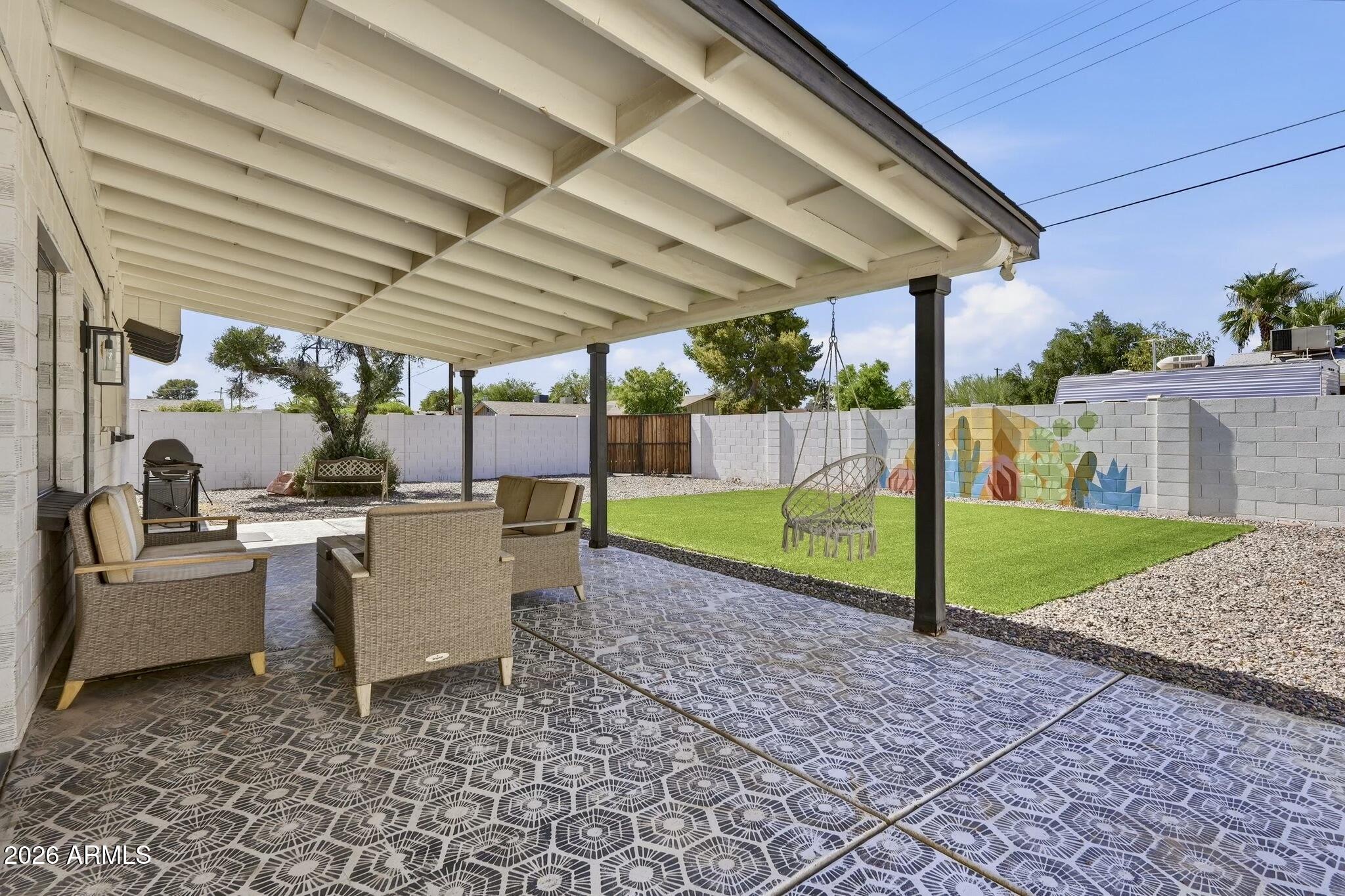 Major updates already completed with NO HOA! Move-in ready on a cul-de-sac just minutes from Old Town Scottsdale, this updated home offers modern finishes, quality upgrades, and an unbeatable location. Major improvements include a 2023 HVAC, 2023 water heater, 2022 sewer line replacement with high-efficiency ABS cleanouts, 2022 RV gate, 2018 roof, turf, and dual pane windows.

Built with durable brick construction, the home features fresh interior and exterior paint, matte black fixtures, brand new bedroom carpet, 2'' wood blinds, 24'' tumbled Noche travertine tile flooring. The kitchen includes stainless steel appliances, neutral wood cabinetry, modern hardware, and breakfast bar. The backyard offers low-maintenance turf, desert landscaping, custom mural by a local artist, storage shed, covered patio, decorative chair, and an RV gate with plenty of room for an RV, boat, trailer, or other recreational toys.

Additional features include a Nest/Yale smart lock, Nest smoke detectors, recessed lighting, and a washer and dryer that convey with the home. The guest bathroom offers a relaxing soaker tub along with an additional linen closet for extra storage.

Located just minutes from Old Town Scottsdale with easy Loop 101 access, this home places you close to premier dining, shopping, golf, spring training, and entertainment. You'll also enjoy nearby access to the Scottsdale Greenbelt, offering miles of walking and biking paths, parks, and beautiful Camelback Mountain views.

Whether you're looking for a primary residence, a lock-and-leave second home, or an investment opportunity in one of the Valley's most desirable locations, this property offers the perfect blend of comfort, convenience, and lasting value.