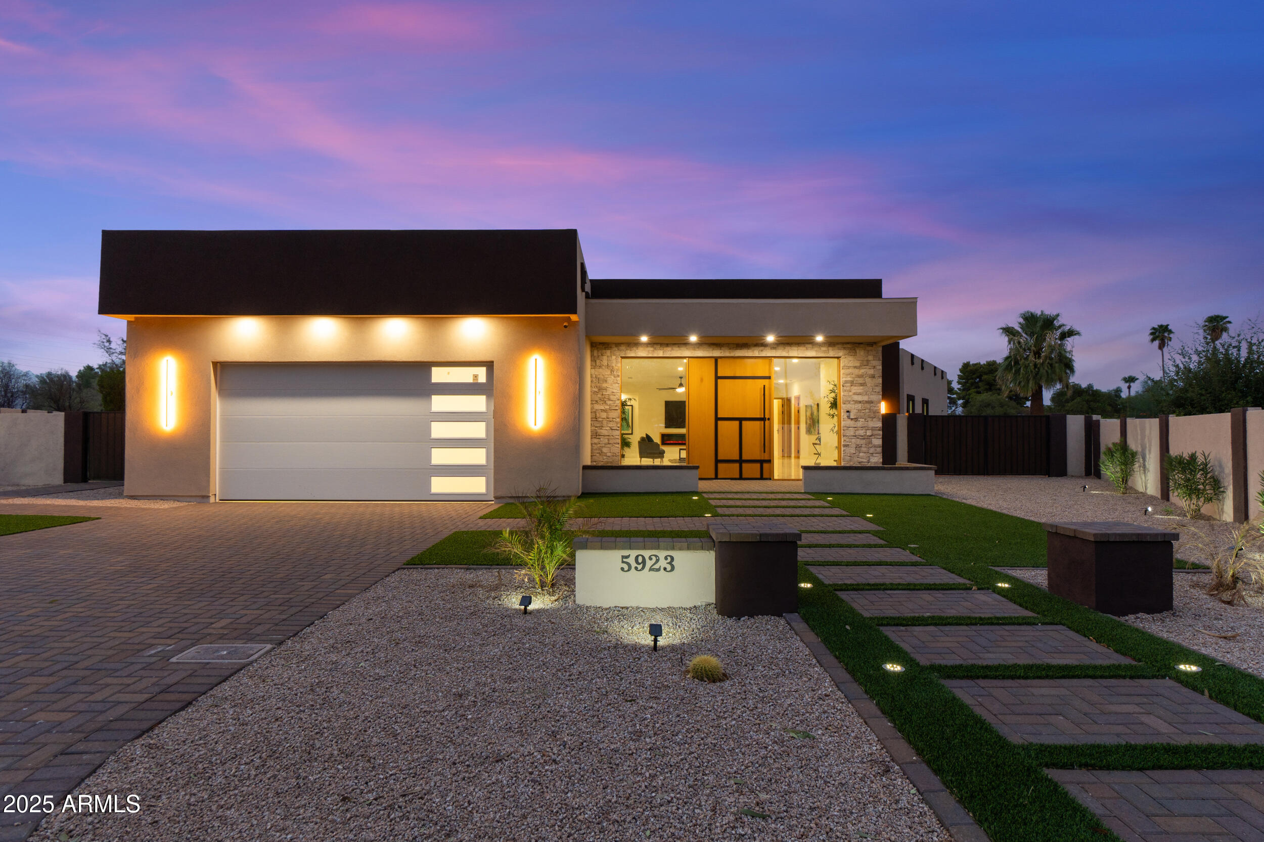 Listed below appraised value. Experience luxury living in this stunning contemporary residence. Completely rebuilt from the ground up, this 4,223 sq. ft. masterpiece was completed in 2025. Nestled among mountain views, tucked away on a private cul-de-sac in the tranquil Country Estates community of Paradise Valley, this home sits on nearly half an acre. It features 4 bedrooms, 4.5 bathrooms, a bright open-concept floor plan, and a split master retreat. 

Expansive windows, tall ceilings and east/west exposure fill the interior with natural light and beautiful views. Designer-selected finishes include porcelain tile flooring, 9-foot custom oak doors, and seamless transitions throughout the home.

The gourmet kitchen showcases custom oak soft-close cabinetry, an oversized island with a breakfast bar, a gas cooktop, premium stainless steel appliances, and a walk-in pantry. The adjoining dining area opens to a wall of sliding glass doors, blending indoor and outdoor living.

The primary retreat is a private sanctuary featuring a cozy fireplace, mountain views, and a custom-designed walk-in closet. The spa-inspired primary bath includes a dual-sink vanity, an oversized walk-in shower, a soaking tub, and a separate tankless smart toilet for ultimate comfort. Each of the additional three bedrooms offers an en-suite bathroom and walk-in closet, ensuring privacy for family and guests.

Designed for entertaining, the home's large covered patio overlooks a brand new pool with an extended travertine pool deck and shaded ramada - perfect for gatherings year-round. The front and backyard are thoughtfully landscaped for low-maintenance living while leaving ample room to add your own touches. 

Located in the highly sought-after CCC school district and just minutes from golf, restaurants, and premier shopping, this exceptional home delivers the perfect balance of luxury, comfort, privacy and lifestyle.