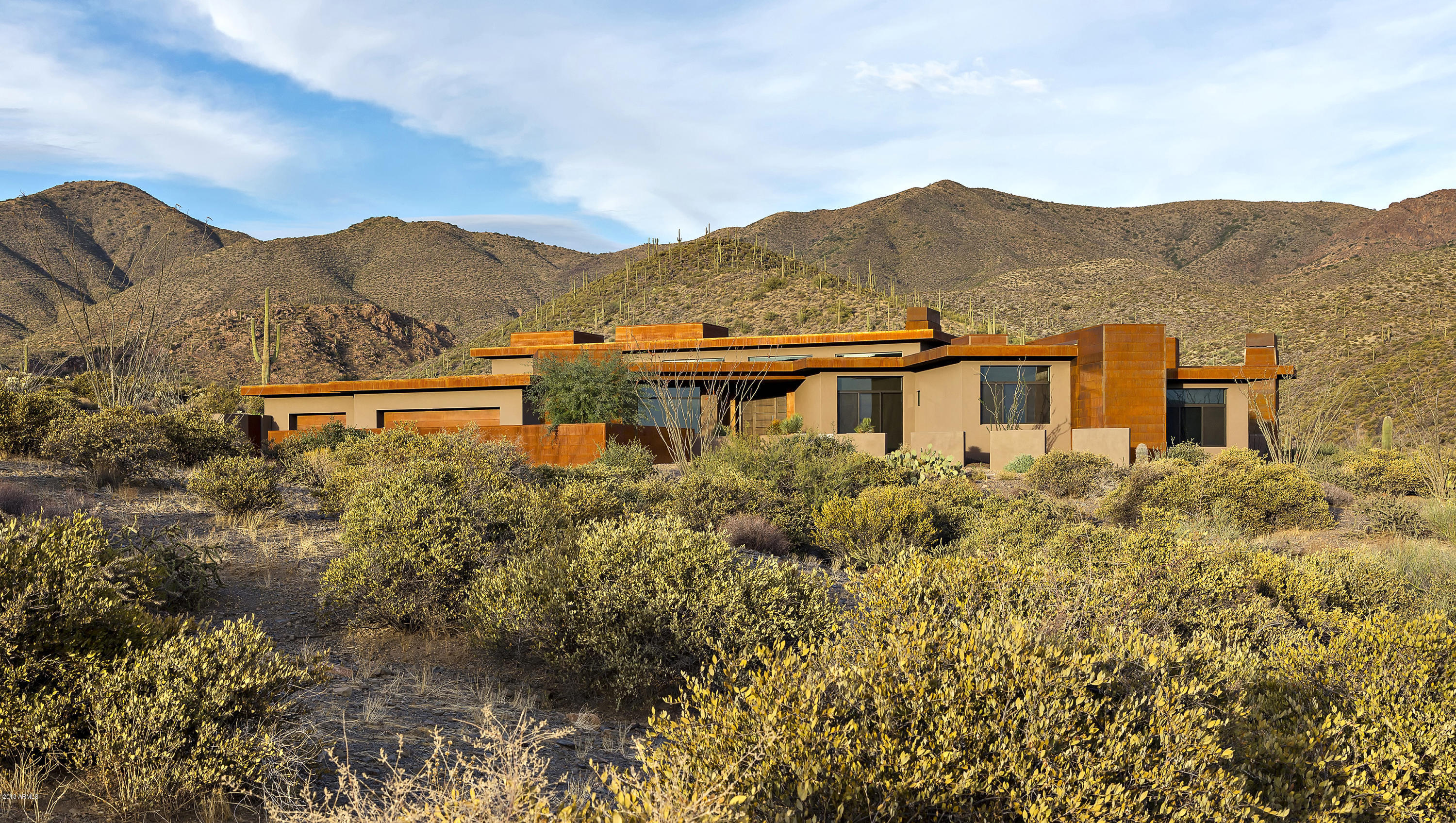 Welcome to the pristine setting of Desert Mountain's Cintarosa saguaro preserve, just steps from the community's private hiking trail system bordering Tonto National Forest. Take in the grandeur of magnificent mountain panoramas from the expansive poolside patio with additional covered outdoor living & dining areas. Enjoy grand city light views from the firepit setting on the sunset patio. Architect Terry Kilbane designed this home in today's trending style of modern architecture, with simplicity of design and open living spaces that complement the serene Sonoran Desert setting. Generous living spaces are appointed with the materials, finishes, appliances and fixtures demanded by our discerning buyers. Stunning master suite with spa bath and fabulous closet space, a view office, and three private guest suites complete this picture-perfect desert retreat. Convenient to Cochise-Geronimo and Chiricahua clubhouses and golf courses. The 2.4 acre site with a building envelope of 31,000+ sf has ample room for a guest house expansion. View "Documents Tab" for location within Community and Village