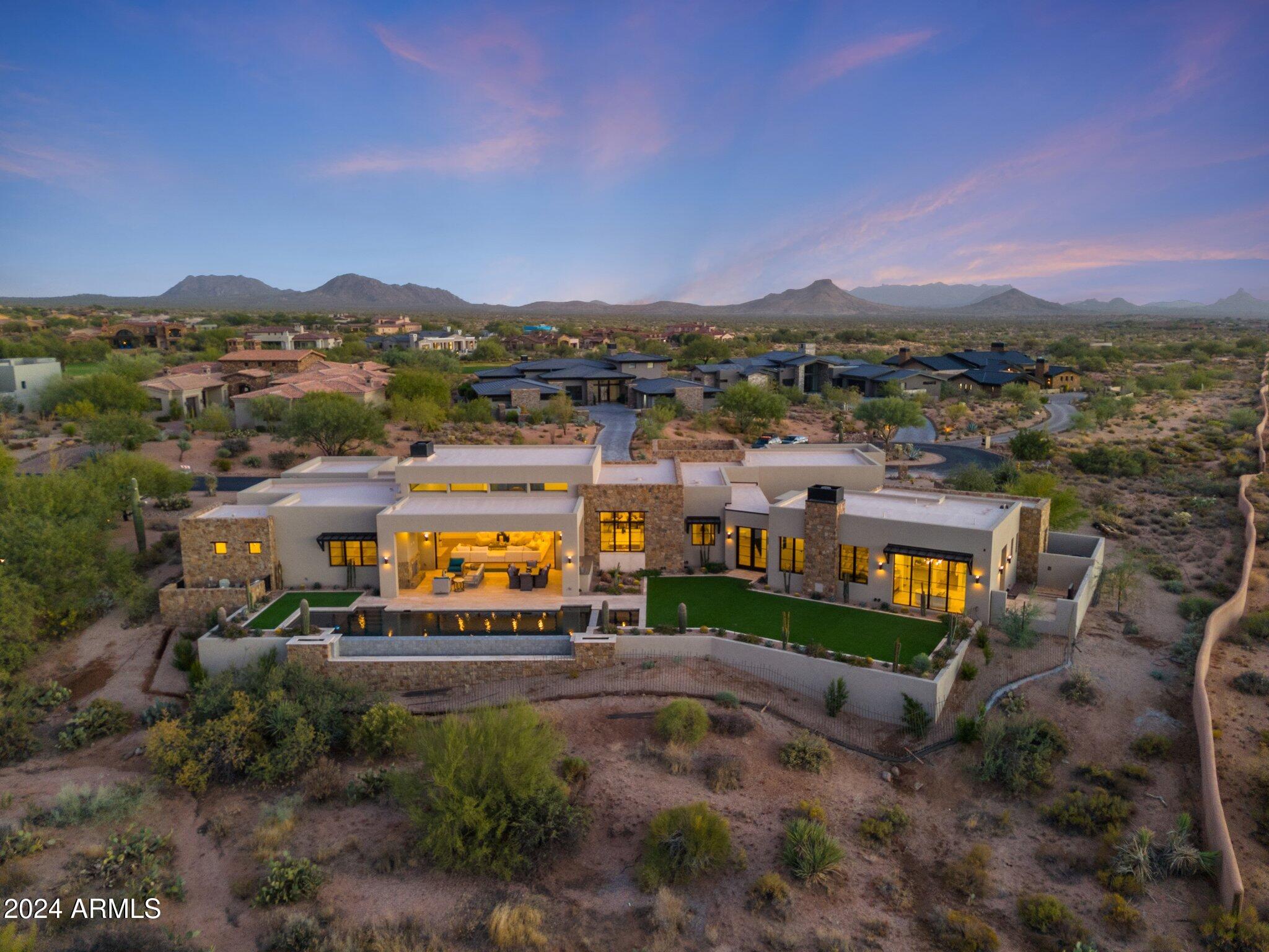 IMMEDIATE MIRABEL GOLF MEMBERSHIP AVAILABLE! Discover refined luxury and exceptional craftsmanship in this newly completed, never-occupied 4,802 sq. ft. modern estate located in the prestigious, guard-gated Mirabel Golf Club, an exclusive community known for its Tom Fazio-designed championship golf course, world-class clubhouse, spa, fitness center, tennis, and fine dining. The home features 4 bedrooms, 4.5 baths, a flexible den/office, and a 3-car garage. Expansive glass doors frame panoramic mountain and desert views, blending indoor and outdoor living. The chef's kitchen impresses with top-tier appliances and an oversized island for gathering. The resort-style backyard offers a heated infinity-edge pool and spa, covered patio, and fully equipped outdoor kitchen, ideal for entertaining. Built by MDF Development, one of the most respected luxury builders in the Valley, and led by renowned developer Frank DiMaggio, known for delivering homes of unmatched quality, design, and attention to detail. Every element of this single-level residence reflects superior craftsmanship and thoughtful design.

Situated on a quiet cul-de-sac among other newly constructed luxury homes, this is a rare opportunity to experience North Scottsdale's best lifestyle, with fine dining, shopping, and outdoor recreation just moments away.