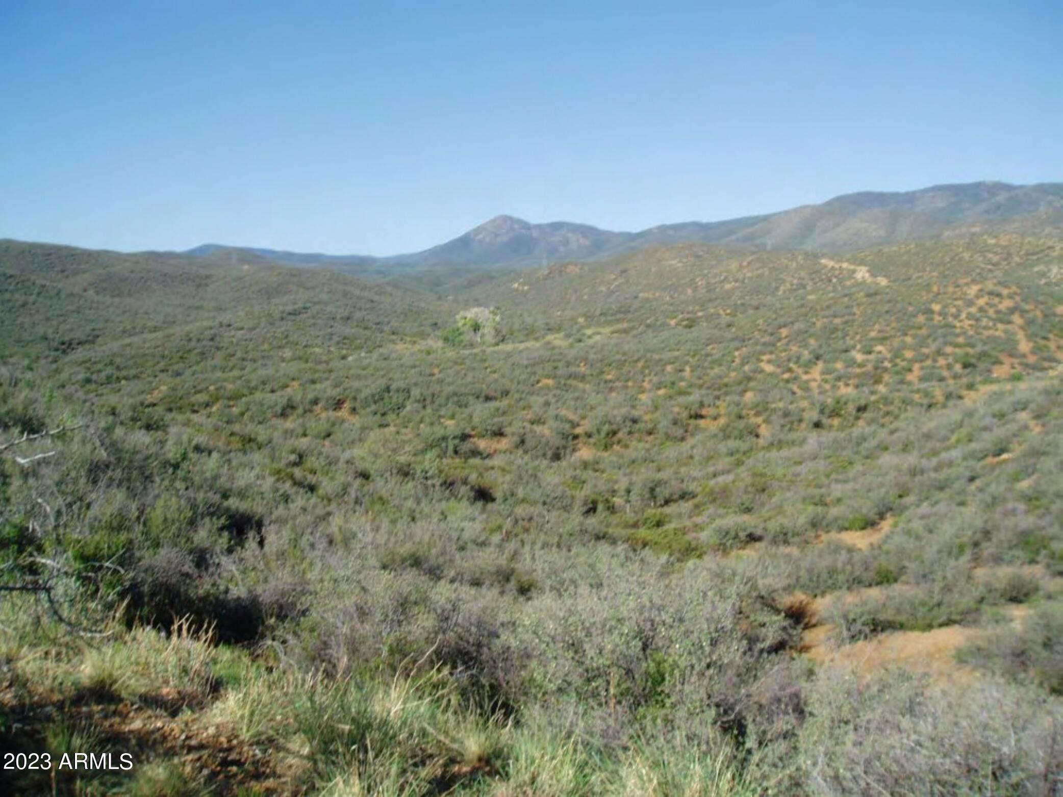 Ready to enjoy a more tranquil pace of life offered by country living? This 3 acre parcel offers just that! Stunning views and privacy await. Close enough to Dewey-Humboldt for all the necessities and just a 20 minute drive to Prescott Valley for all your amenities and shopping. Transform this lot into the vision of your dreams! Bring your horses down and create your country retreat. Enjoy the cooler temps year round.