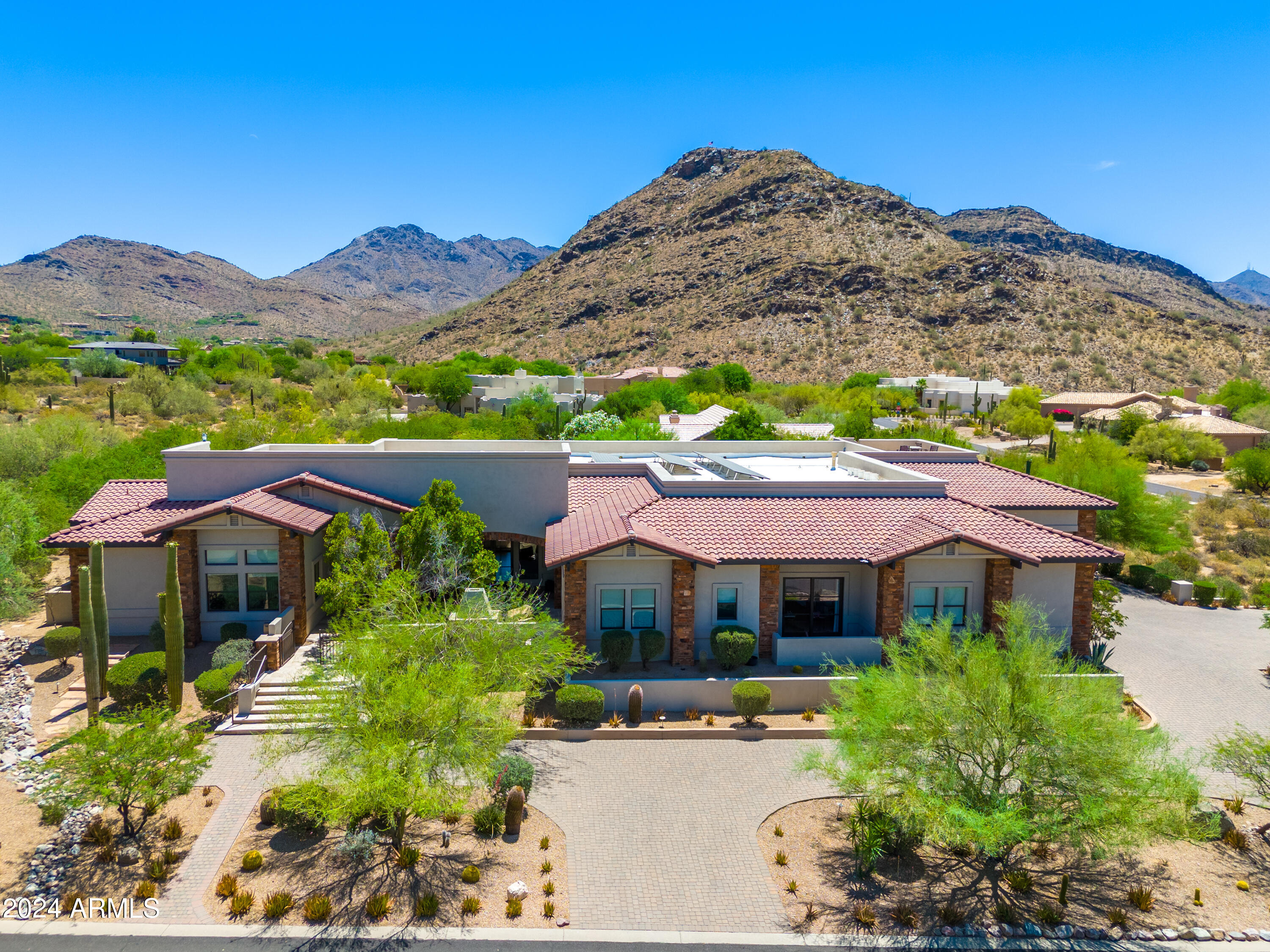 Preparing home for market!!!  Beautiful custom family home on 1.3 acres with stunning mountain views. Split floor plan, with 3 guest ensuites with walk-in closets and guest family room in the main home.  649SF separate guest house with kitchenette, living area, bedroom with walk-in closet, full bathroom & private patio.  Tall coffered ceilings and large windows/sliding doors allow for natural light & mountain views.  All major rooms open onto their own private covered patios.  The front of the home enjoys a private courtyard with gas fireplace.  Gorgeous chef's kitchen with large island, white wood cabinetry with stack cabinets & glass fronts, soapstone countertops, stainless steel appliances, dual sinks, dual dishwashers, walk-in pantry & dining.  Separate wet bar with beverage refrigerator & ice maker.  Spacious family & living rooms with fireplaces.  Large primary retreat with private patio, oversized walk-in closet with washer/dryer, spacious bathroom with heated flooring.  Large den/office with bookcases & another private office or crafts area for the kids.  Beautiful private back yard with large lap pool & spa, grassy play area and roof-top deck.  4 car garage with 14' ceilings, extra deep bays, 2 separate storage rooms & rock climbing wall.