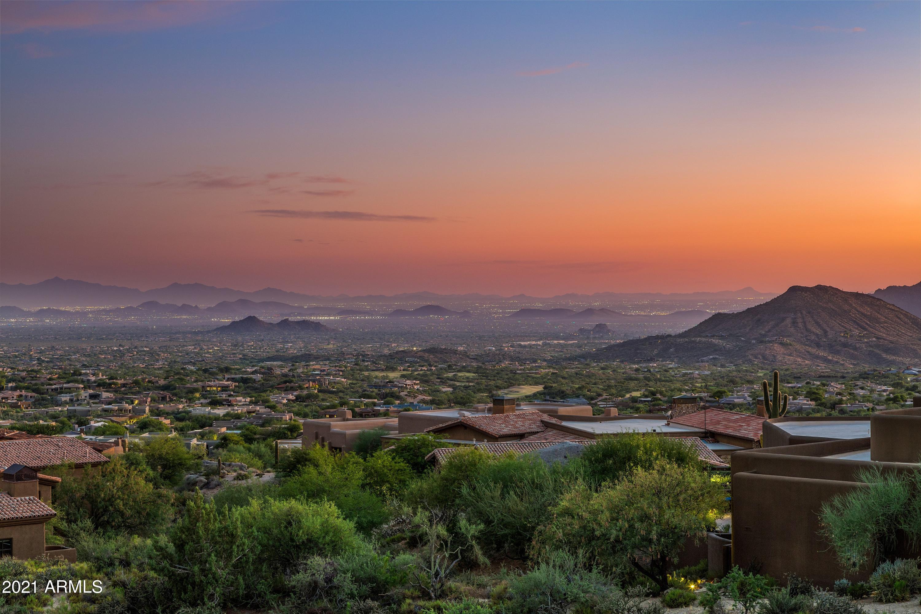 Extraordinary opportunity to own 3 contiguous homesites in North Scottsdale's, Desert Mountain! There is currently a desert contemporary estate built by Salcito on one lot plus 2 additional lots providing extreme privacy & protected million-dollar, south-facing panoramic city light, mountain & sunset views. The 3 parcels are nestled at the base of Apache Peak at an elevation of 3,360 feet on 3.6 stunning acres. Designed with indoor/outdoor living in mind, the home has been stripped down to its frame & is ready for your builder/designer team to create your dream home saving years of time. Lush gardens remain that surround the spacious resort style pool, covered ramada & casita. Options are endless, keep or scrape some, or all of the existing home which is completely demoed to the studs with tile floors removed. Desert Mountain's lifestyle is like none other with seven world-class clubhouses & golf courses, award winning fitness center, spa, tennis complex, private hiking trails, pickleball, horseback riding and so much more. The community is 8,000 acres of pure fun, guard-gated in the beautiful high Sonoran Desert where the air is clean, the wildlife is abundant & the stars are brilliant.