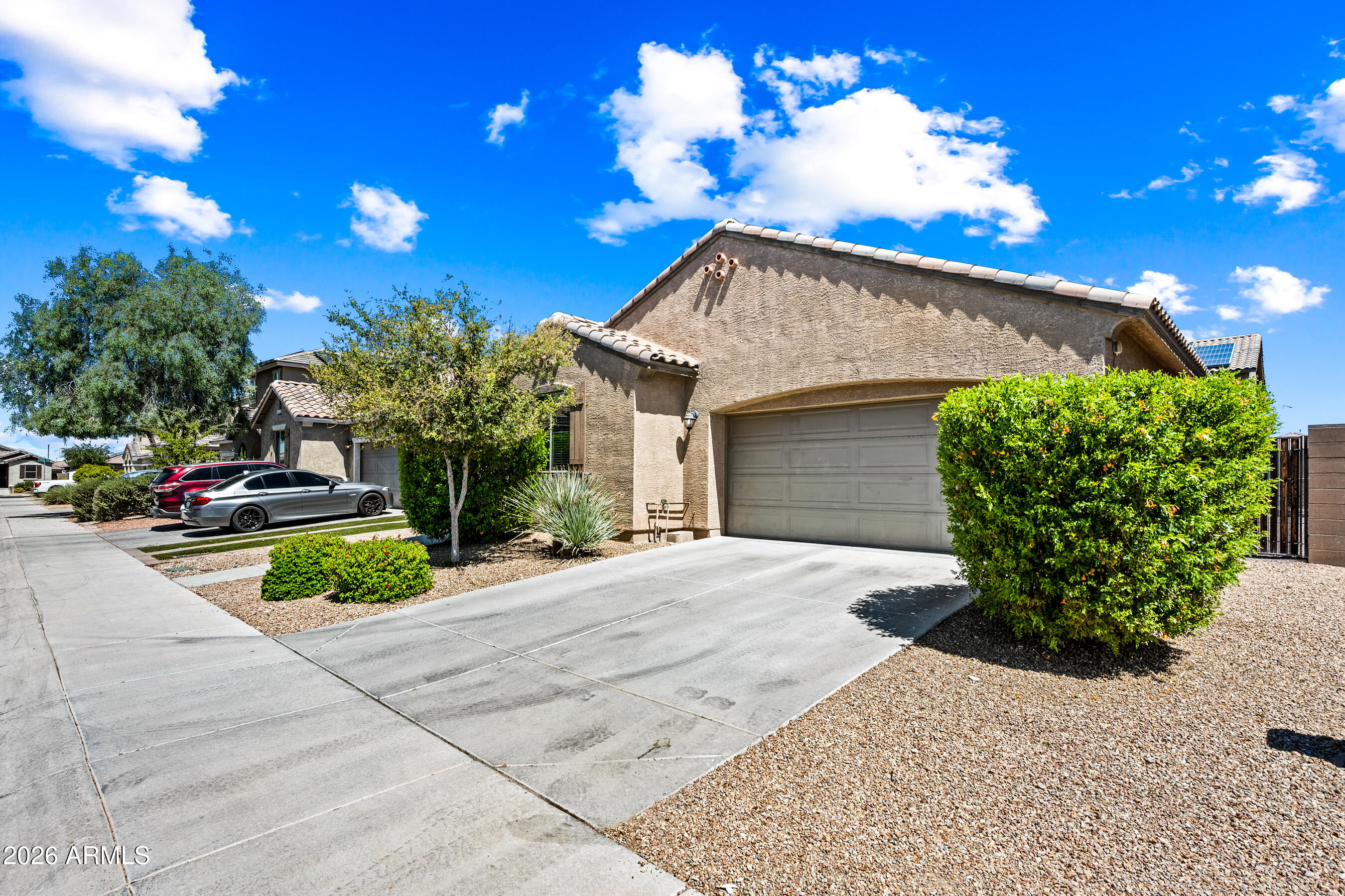 This inviting bright and beautiful single-level 3-bedroom, 2-bathroom home offers 1,501 sq ft of functional living space in a sought-after Peoria neighborhood. The practical split floor plan delivers excellent privacy for the primary suite while keeping the additional bedrooms well positioned. The generous primary bedroom includes double sinks, an ample walk-in shower, and a spacious walk-in closet. Throughout the main living areas you'll find durable 18-inch tile flooring (with carpet in the bedrooms for comfort). The updated kitchen boasts granite countertops, a large central island with modern pendant lighting, maple cabinetry, a gas cooktop, and stainless steel appliances--ideal for daily use and casual gatherings. A highlight of the home is the expansive 12-foot multi-slide door that opens to the covered back patio, creating smooth indoor-outdoor living perfect for Arizona lifestyles.
The backyard features easy-care synthetic grass, pavers and a dedicated dog run, while the 2-car garage and ample storage add everyday convenience.
Located in a friendly Peoria neighborhood, this home is served by Lake Pleasant Elementary and Liberty High School in the Peoria Unified School District. Residents enjoy quick access to multiple neighborhood parks, extensive hiking and biking trails (including nearby mountain trailheads), and community amenities. Shopping, dining, and entertainment are minutes away at Park West lifestyle center, with its array of restaurants, shops, and Harkins Theatre. Outdoor enthusiasts will appreciate proximity to Lake Pleasant for boating and recreation.
This turnkey home combines thoughtful updates with a smart layout in a convenient Peoria location. It is the home you have been waiting for!