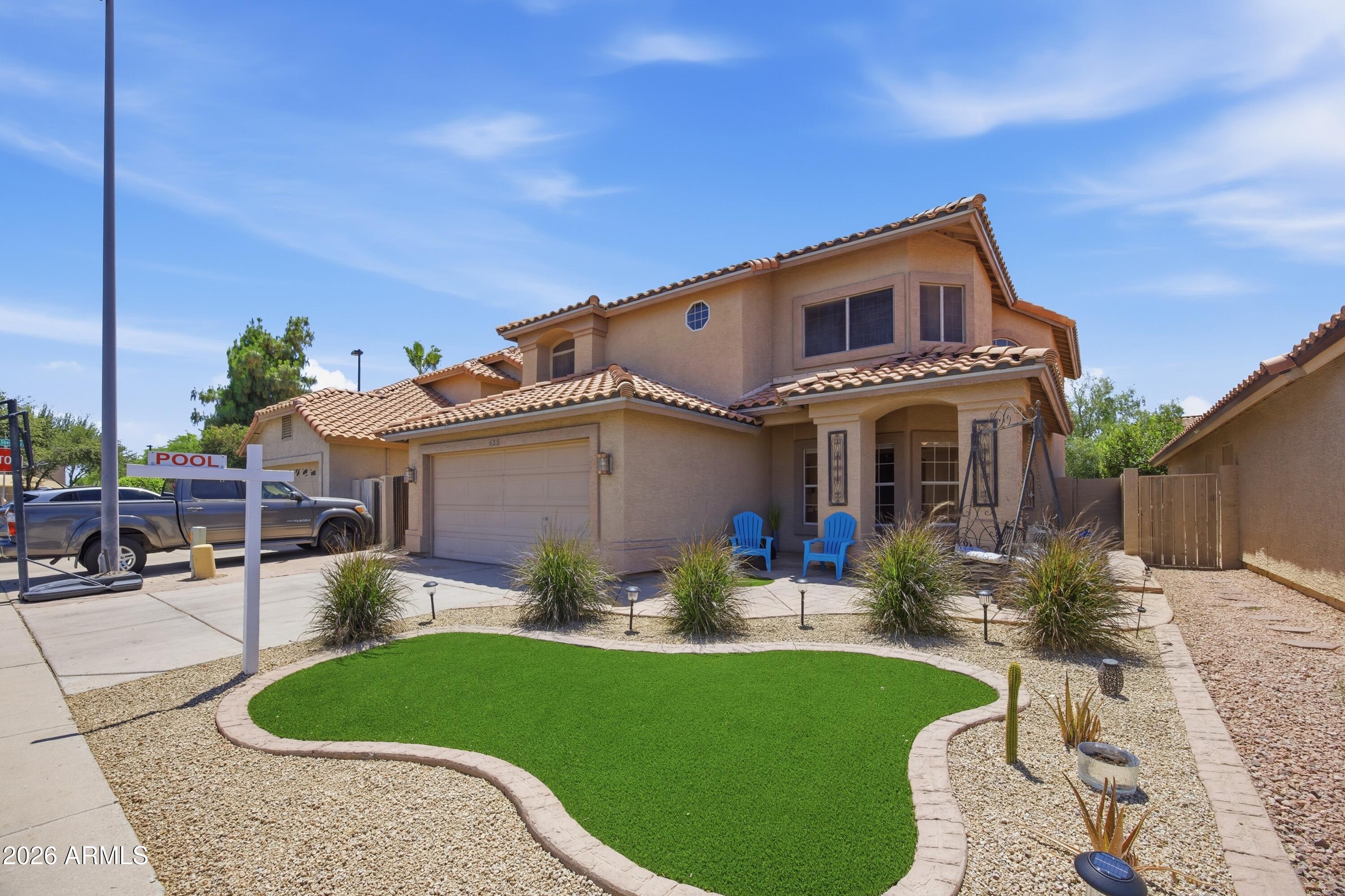 Overlooking a sprawling greenbelt with beautiful lake views nearby, this stunning 3BR + office + loft, 2.5BA, 2-story home in The Islands offers designer living! Featured on HGTV's Love It or List It in 2017, showcasing a sparkling pool, maintenance-free landscaping with brand-new turf and rock, fresh Agreeable Gray interior paint, and modern gray LVP flooring. Renovated baths, and a luxurious primary suite include marble tile, chandelier lighting, double sinks, and new toilets (TOTO & Kohler). Additional upgrades include a brand-new RO system installed 5/13/2026, new appliances (Electrolux, Frigidaire & Whirlpool 2025-2026), new patio roof, and meticulously maintained HVAC. Near top schools and minutes from vibrant Downtown Gilbert dining & shopping. Live your dream in paradise!