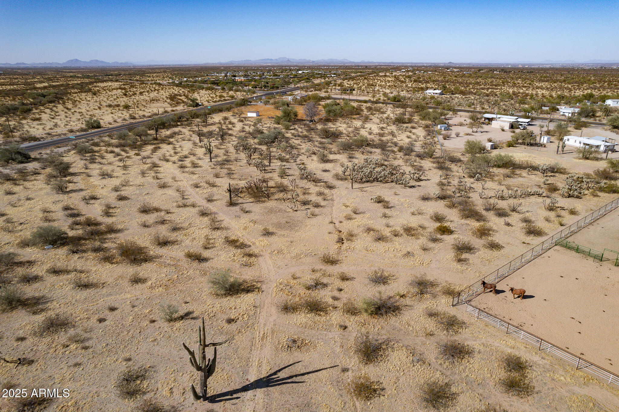 This parcel, located along Highway 79 in the rapidly growing Florence, AZ, presents significant commercial potential for builders and developers. The northern portion of the lot contains a small riparian area, which must be preserved in accordance with Pinal County zoning regulations and may be suitable for use as a rest area. Utilities are available at the frontage road. Additionally, the owner holds several nearby lots, offering potential for further development opportunities.